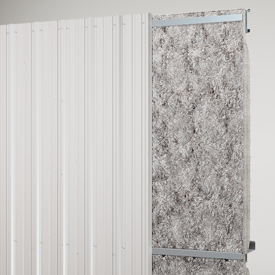 Metal wall panel with vertical ribs partially cut away to reveal high R-value insulation within the wall assembly