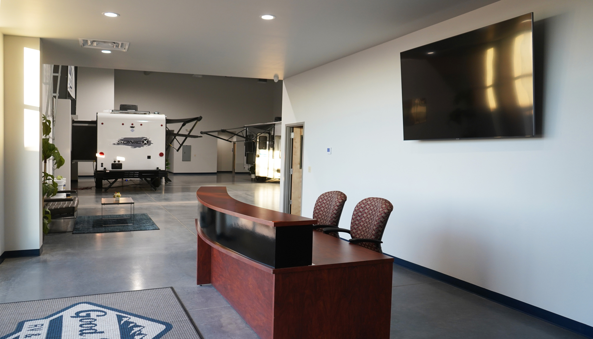 Interior showroom and customer reception area at the Good Sense RV & Motors facility featuring integrated retail and display space.
