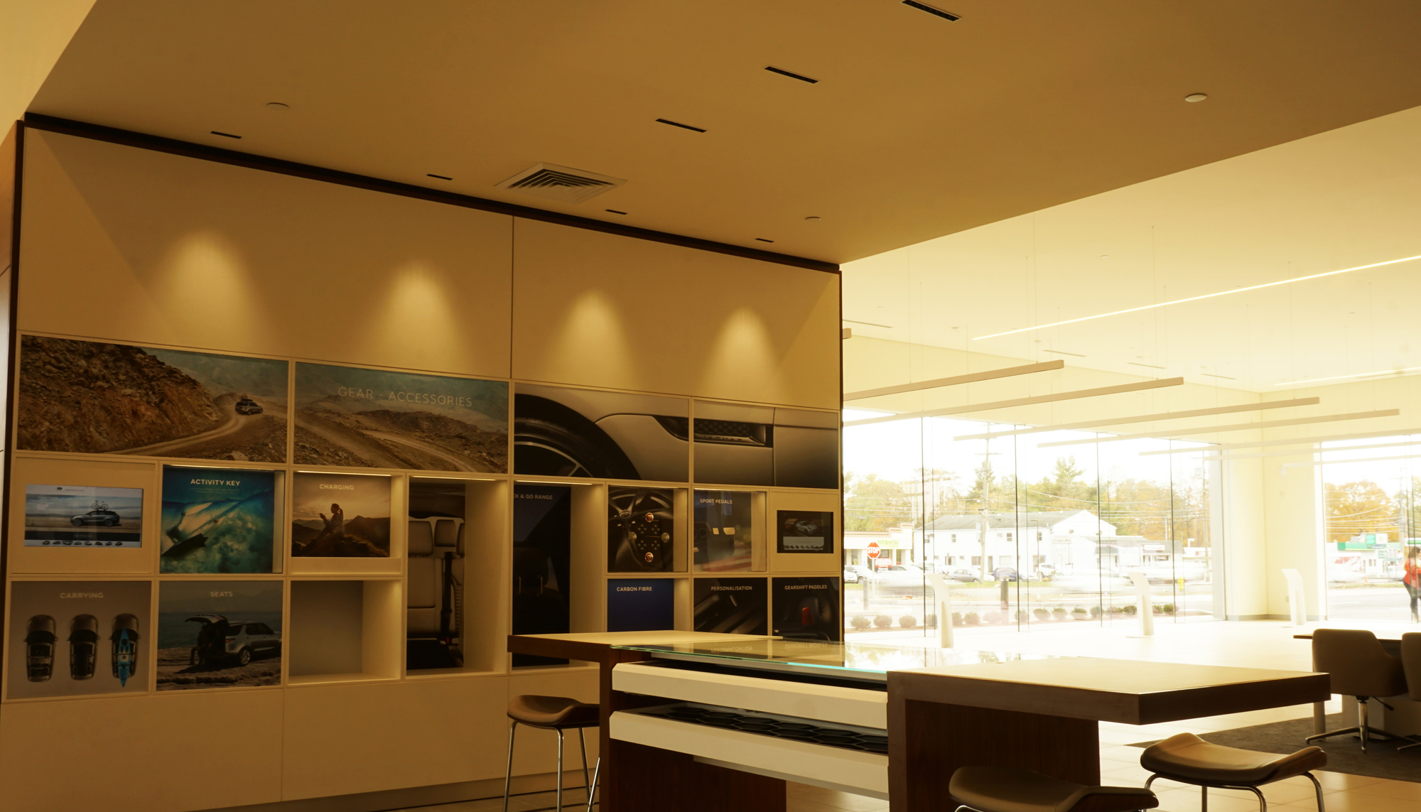 Interior showroom and customer consultation area at the Jaguar Land Rover dealership featuring integrated display spaces, premium finishes and coordinated retail environments designed to support brand experience, customer engagement and operational efficiency.
