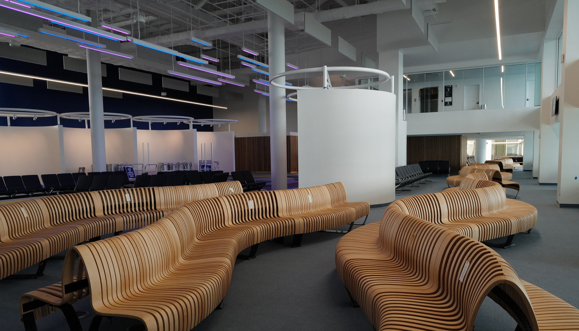Interior passenger waiting area at the PortMiami Terminal F Roof Retrofit featuring integrated seating, open circulation space and a coordinated terminal environment enhanced through innovative retrofit design.