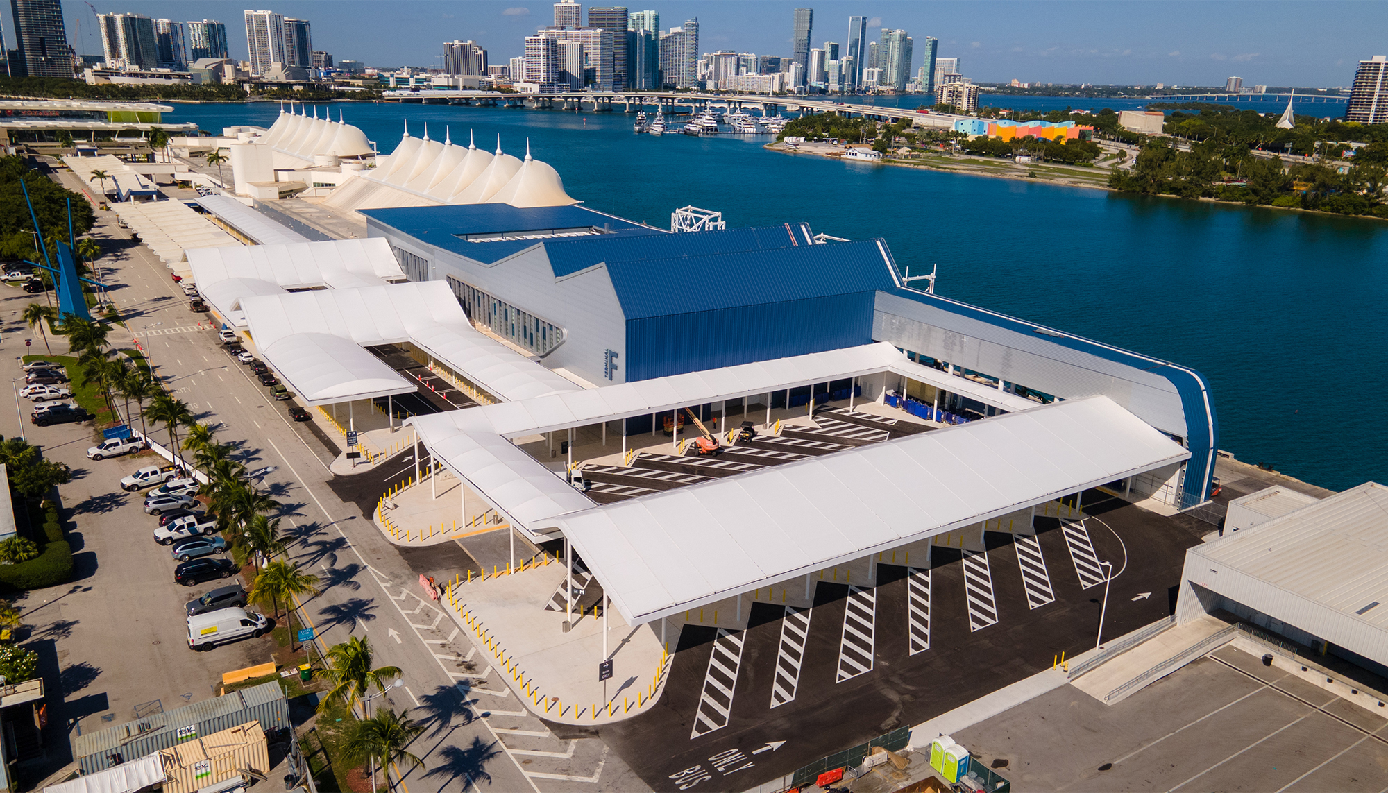 Aerial view of the PortMiami Terminal F Roof Retrofit featuring an innovative waterfront roof system integrated into an active cruise terminal through coordinated retrofit planning, structural adaptation and collaborative execution.