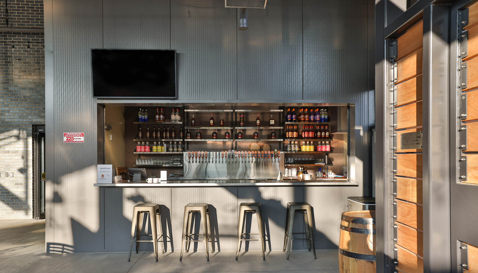 New Holland Brewery interior image of exposed steel beams mixed with wood facade