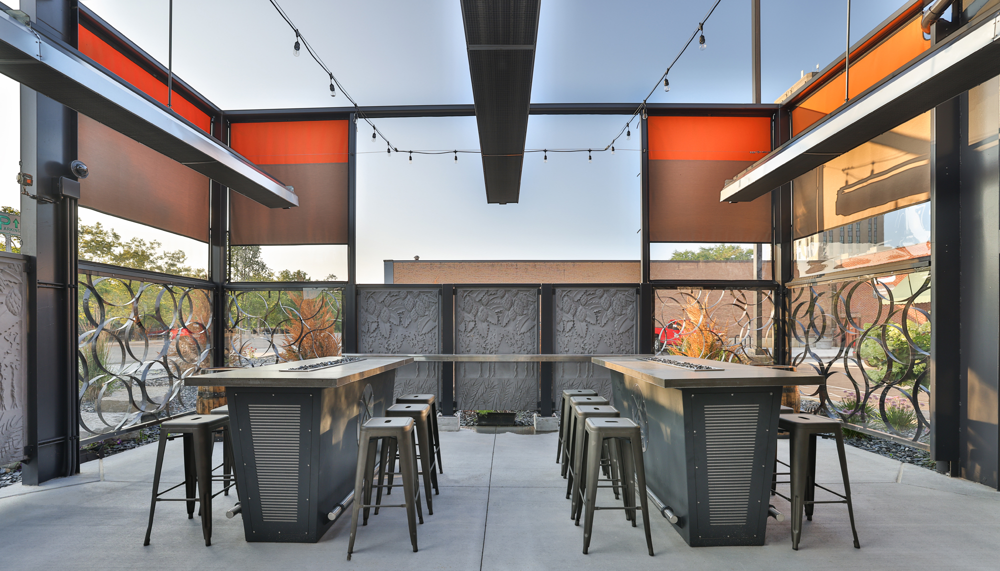 Interior seating area at the New Holland Brewing Co. beer garden featuring integrated indoor-outdoor hospitality space, flexible community gathering areas and coordinated design developed to support year-round dining and entertainment.