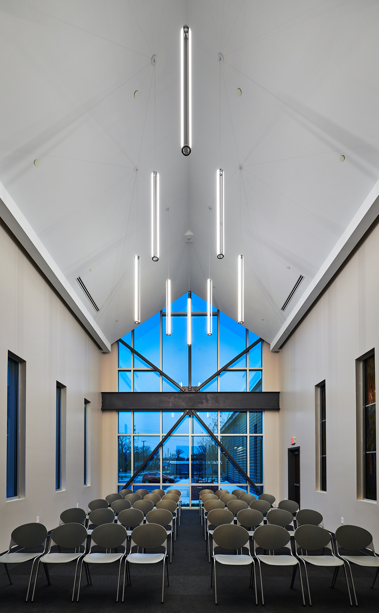 Interior gathering space at the Firehouse Shelter – New Facility featuring integrated seating, natural light and coordinated community environments designed to support resident services, group programs and a welcoming daily experience.