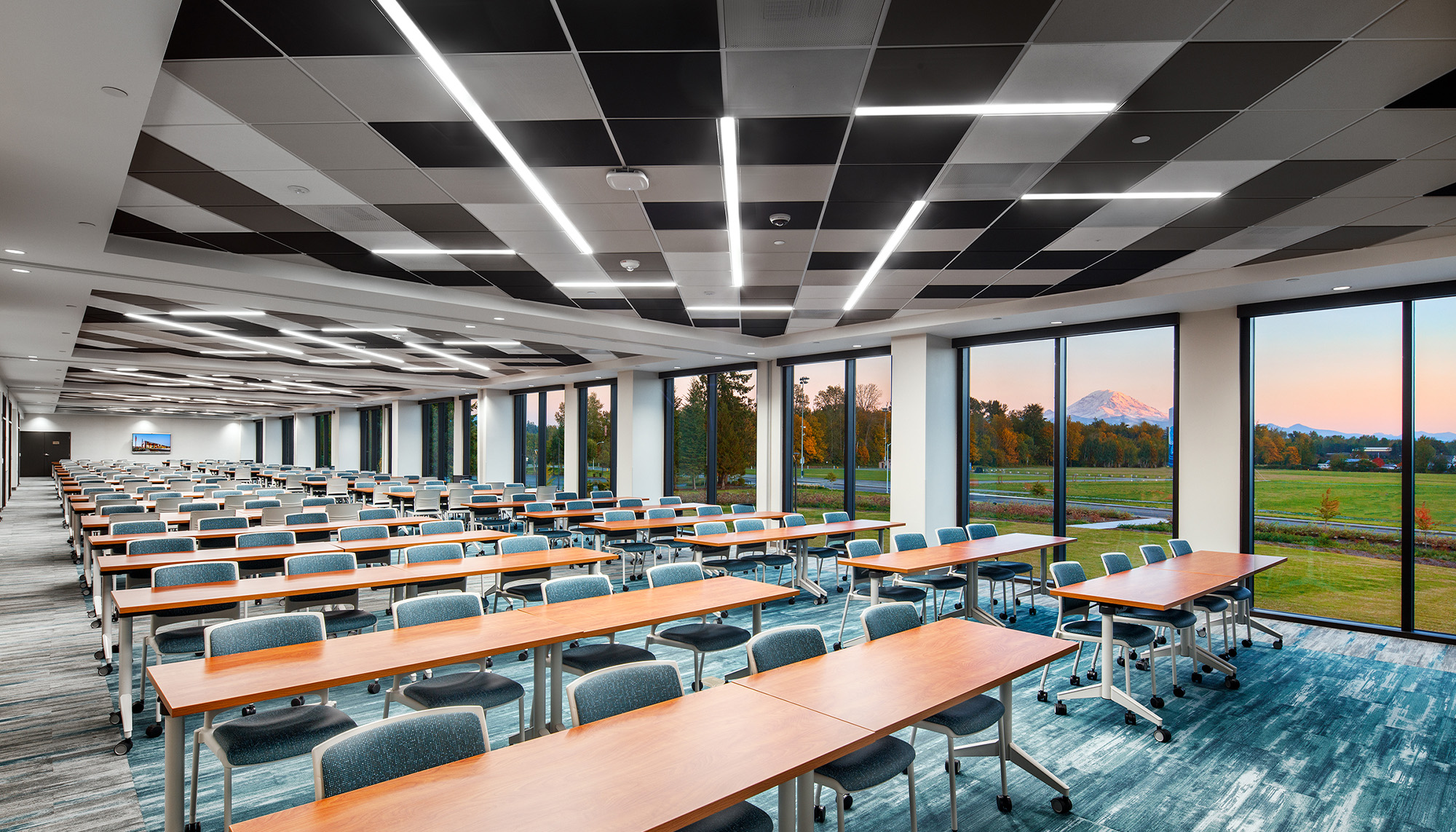 Educational facility interior featuring collaborative learning space, open floor plan and modern steel building construction.