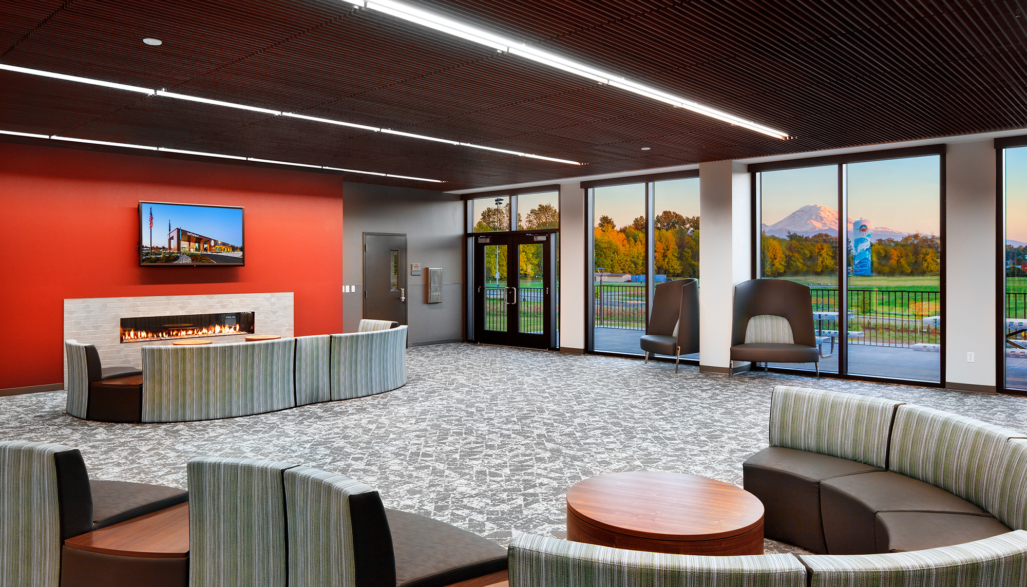 Community recreation center lobby featuring modern interior finishes, gathering spaces and commercial steel building design.
