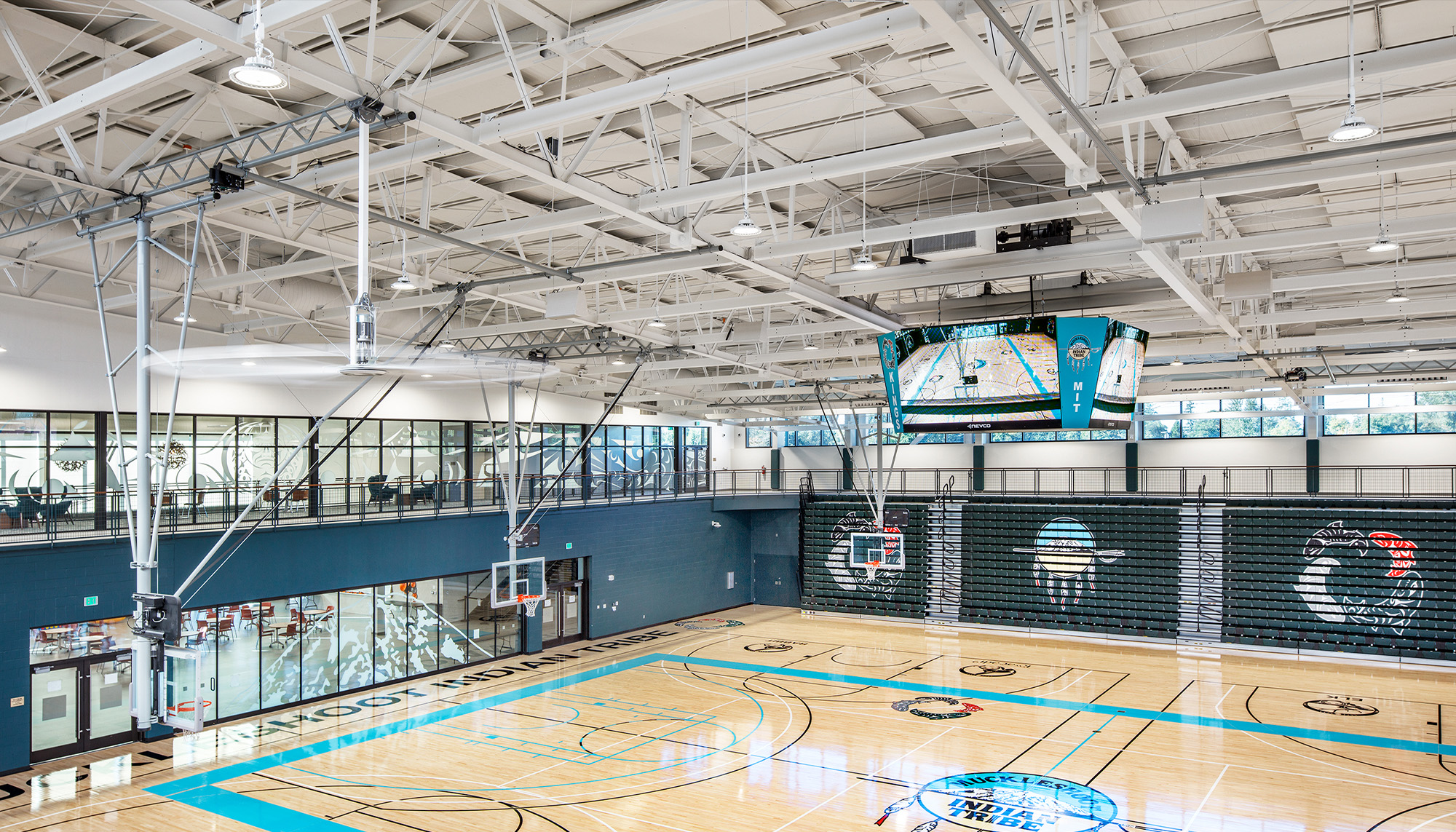 Indoor sports complex featuring clear span steel framing, basketball courts and multi-purpose recreation facility design.