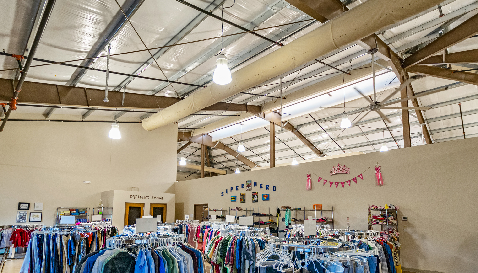 Interior donation and retail area at the Florida Baptist Children's Homes – H.C. Simmons Compassion Center featuring integrated storage, sorting and community support spaces designed to improve operational efficiency and outreach services.