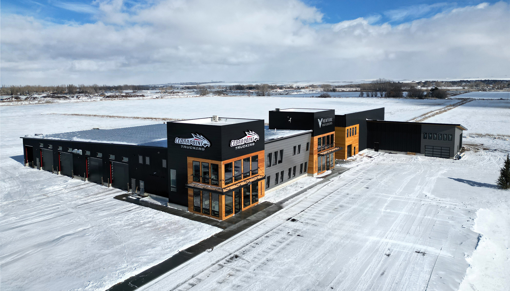 Aerial view of Cedarpoint Trucking Headquarters featuring office space, fleet maintenance bays and integrated operations facilities.