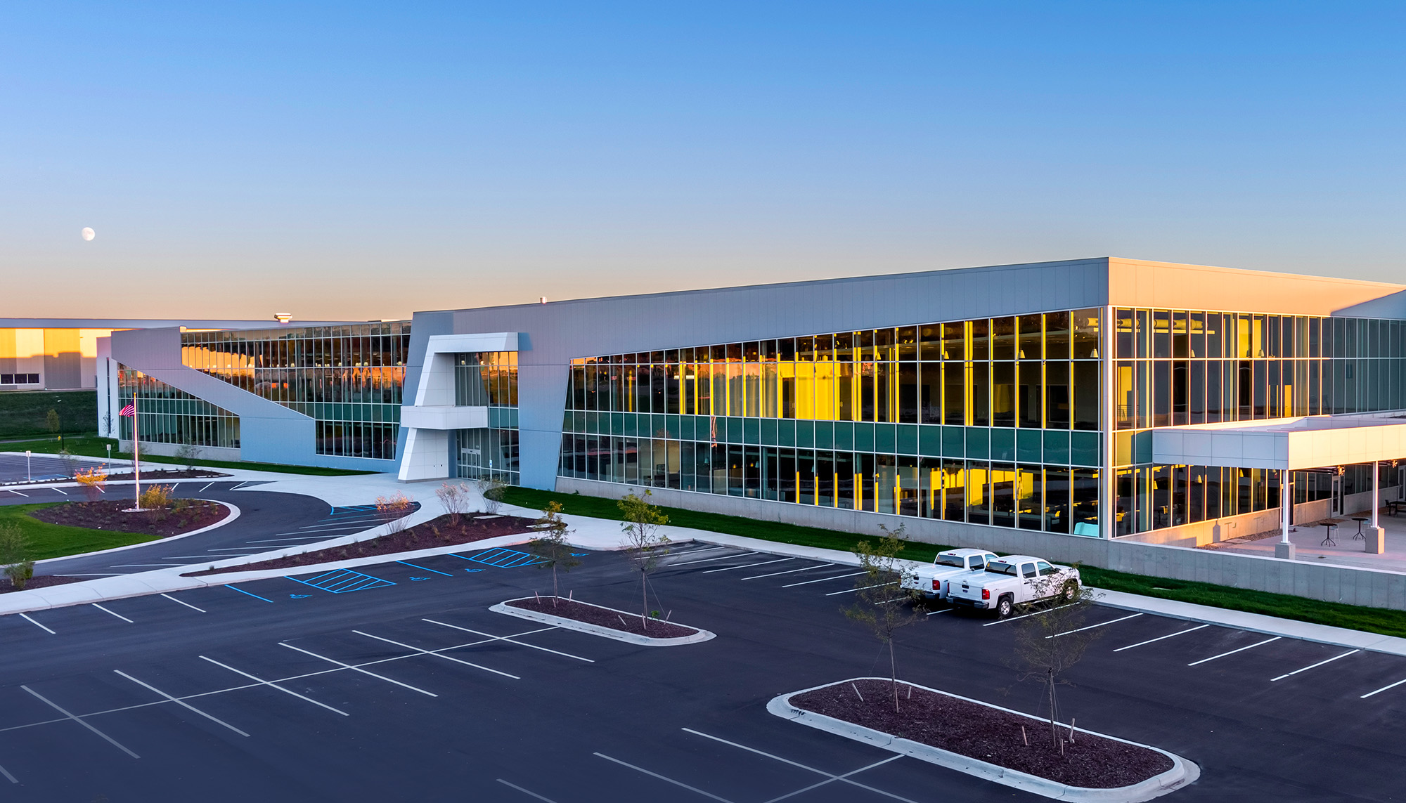 Corporate headquarters facility featuring curtain wall glazing, architectural metal wall panels and modern steel building construction.