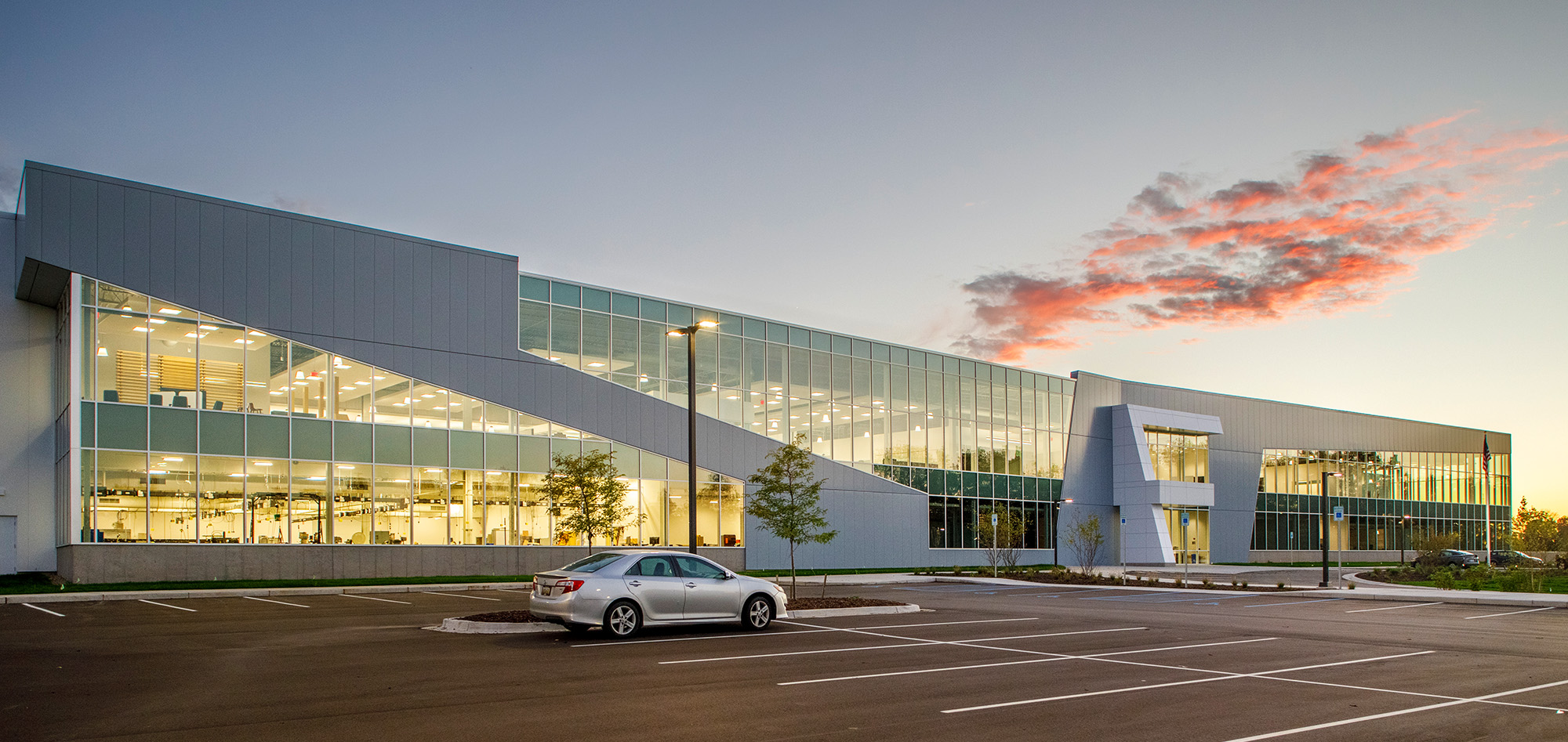 Modern office facility with expansive glass facade, metal building systems and commercial steel building design.