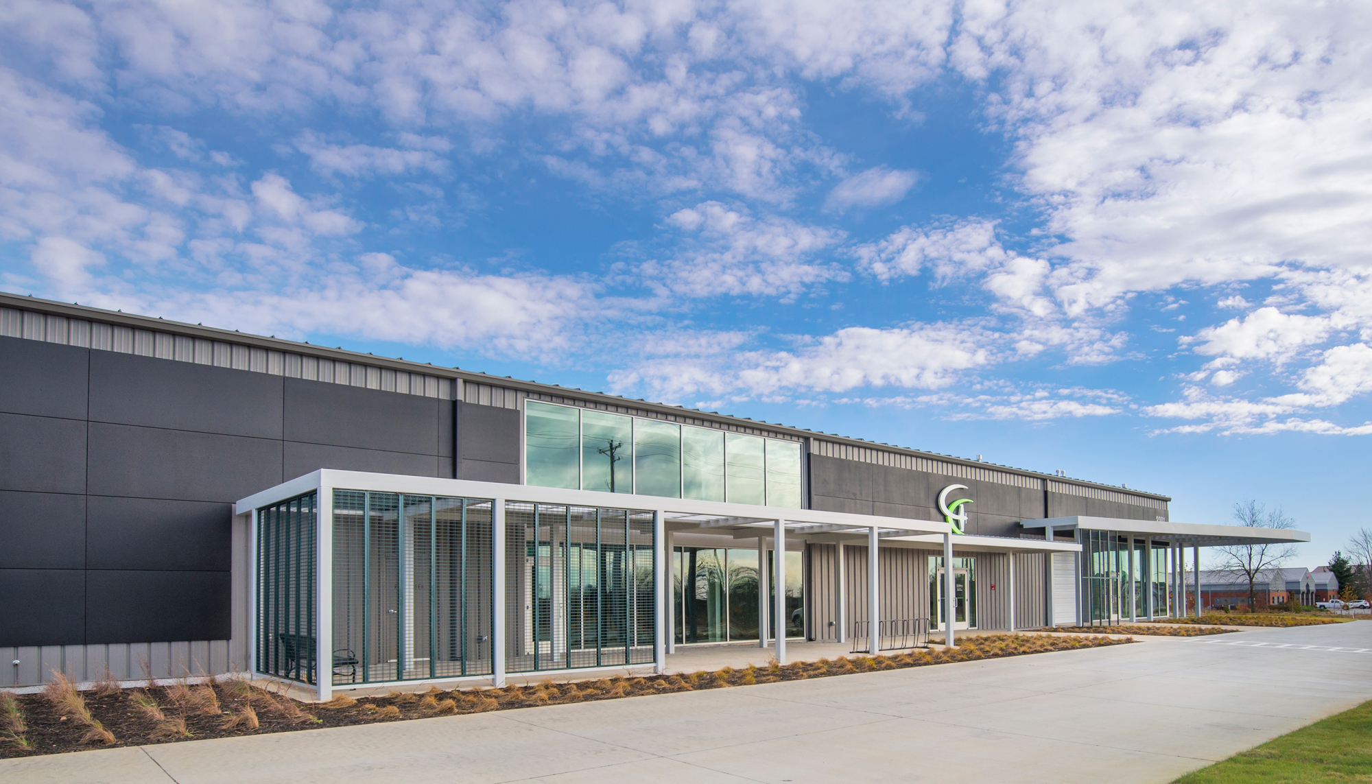 Exterior entrance view of the Game Aerospace facility featuring integrated office, manufacturing and aircraft operations spaces designed to support coordinated production workflows and specialized aviation requirements.