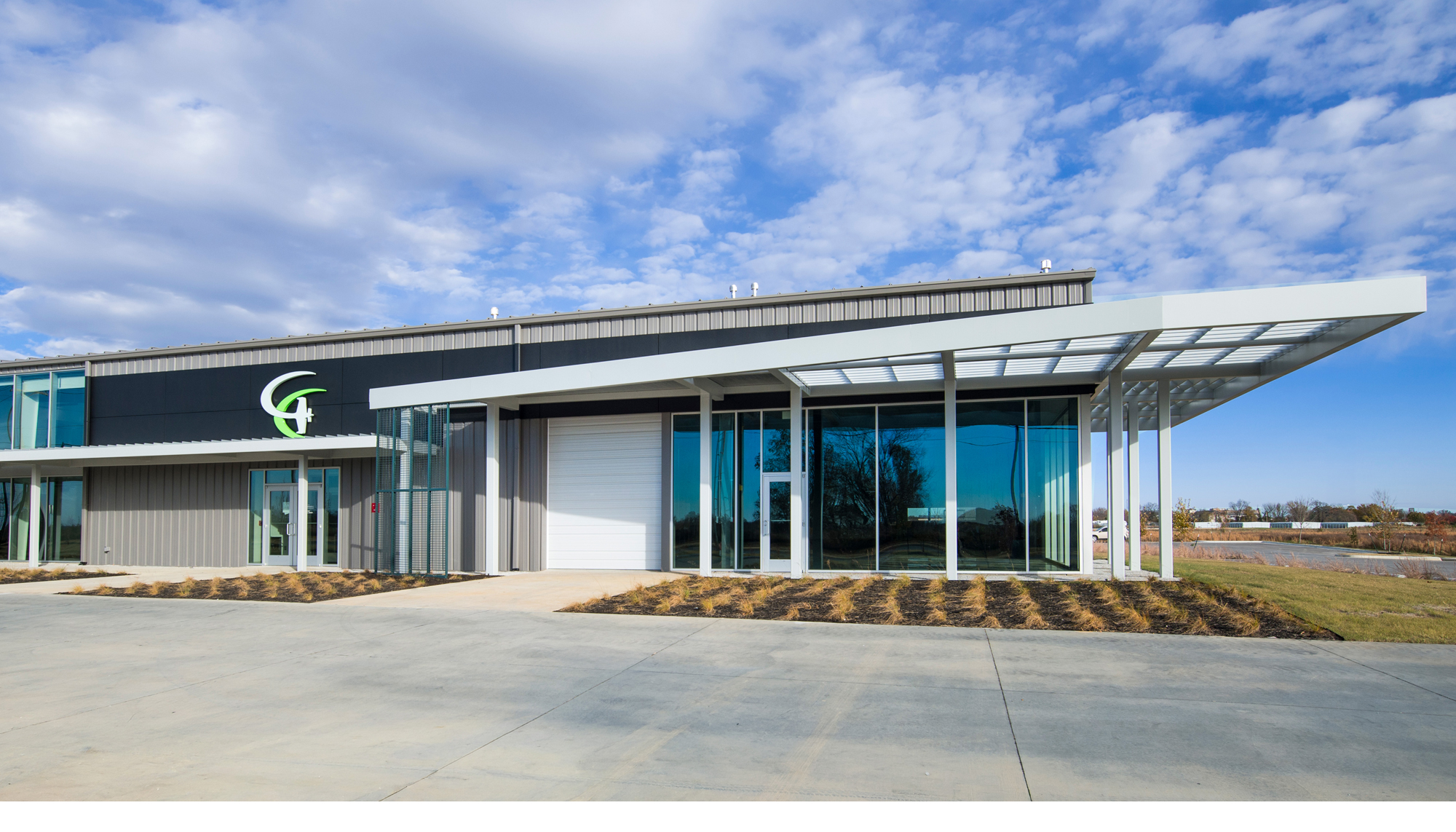 Exterior perspective view of the Game Aerospace facility featuring integrated aviation manufacturing, office and aircraft operations spaces designed to support efficient production workflows, specialized equipment needs and long-term operational flexibility.