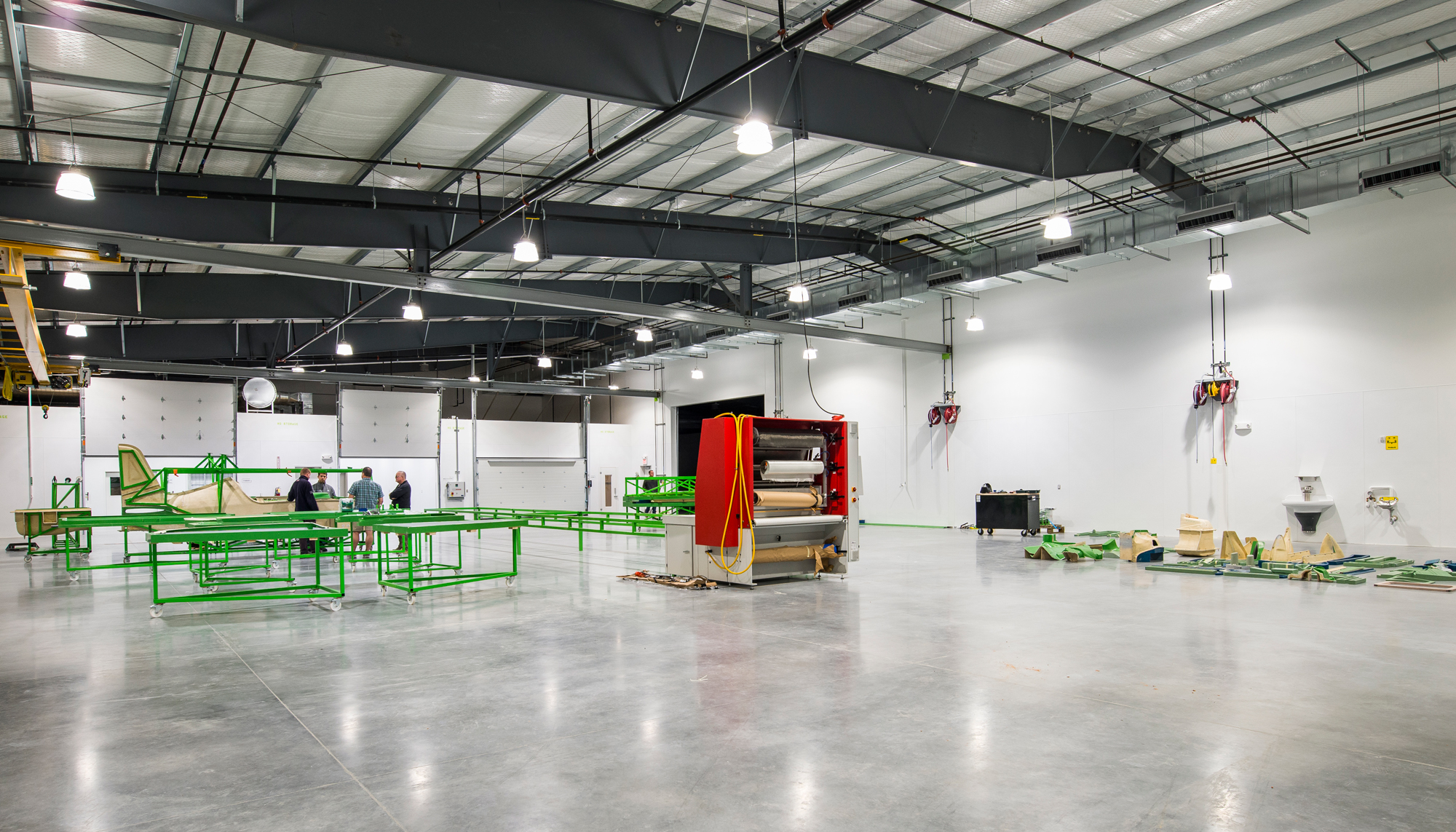 Interior manufacturing space at the Game Aerospace facility featuring integrated production equipment, open operational layout and coordinated aviation workflows designed to support specialized manufacturing processes and future operational flexibility.