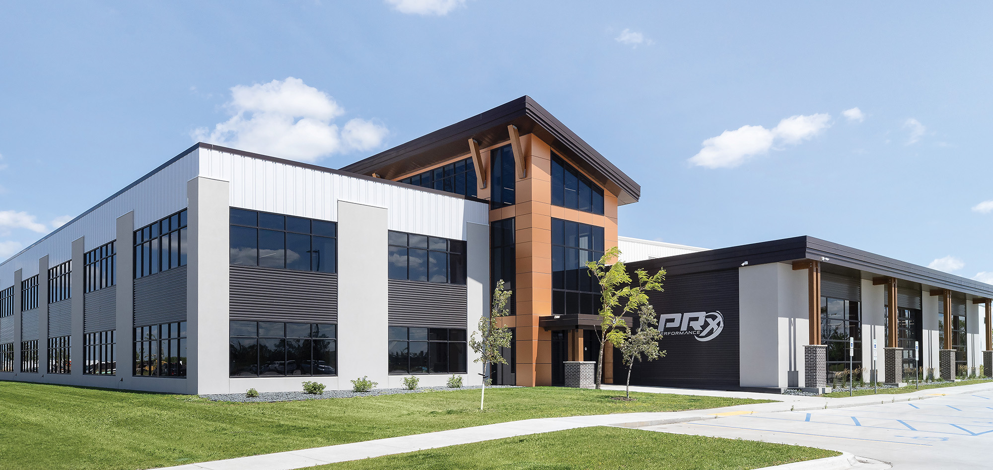 Corporate office facility with steel building systems, expansive glass facade and integrated workplace design.