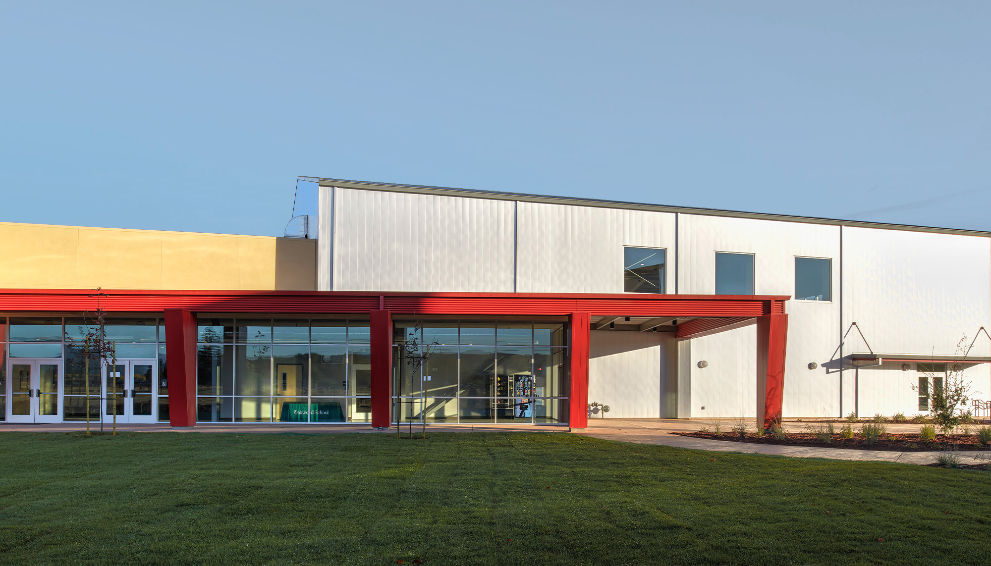 Educational facility with metal building systems, storefront glazing and community center entrance design.