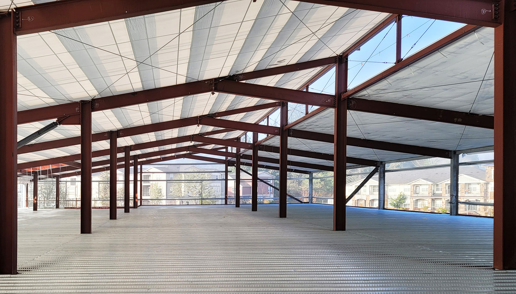 Interior structural framing at the Oregon State University Campus Operations Center featuring integrated steel systems designed to support heavy loads, seismic performance and coordinated multi-level campus operations.