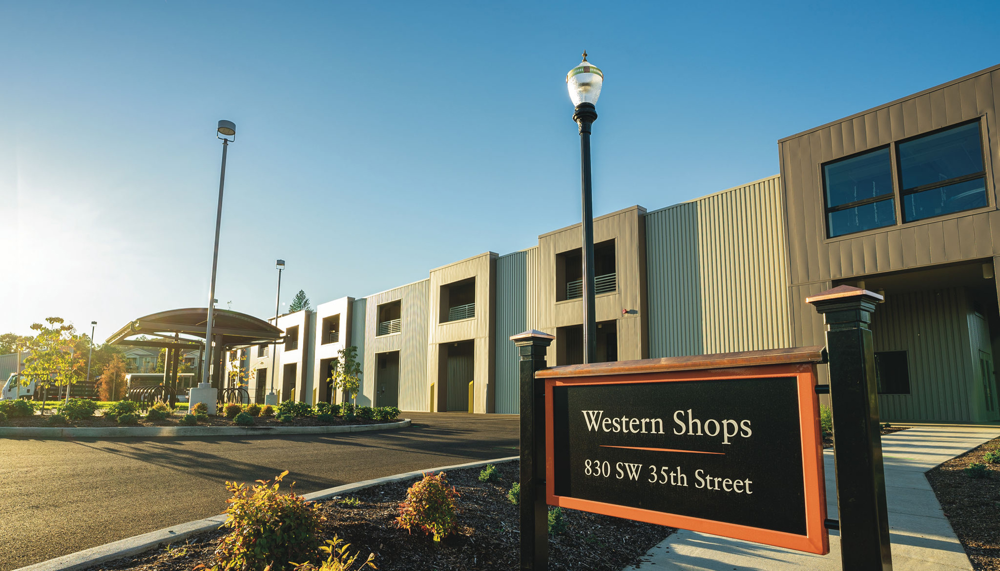 Exterior view of the Oregon State University Campus Operations Center featuring the Western Shops entrance and a centralized operations facility designed to improve campus coordination, maintenance efficiency and long-term operational performance.