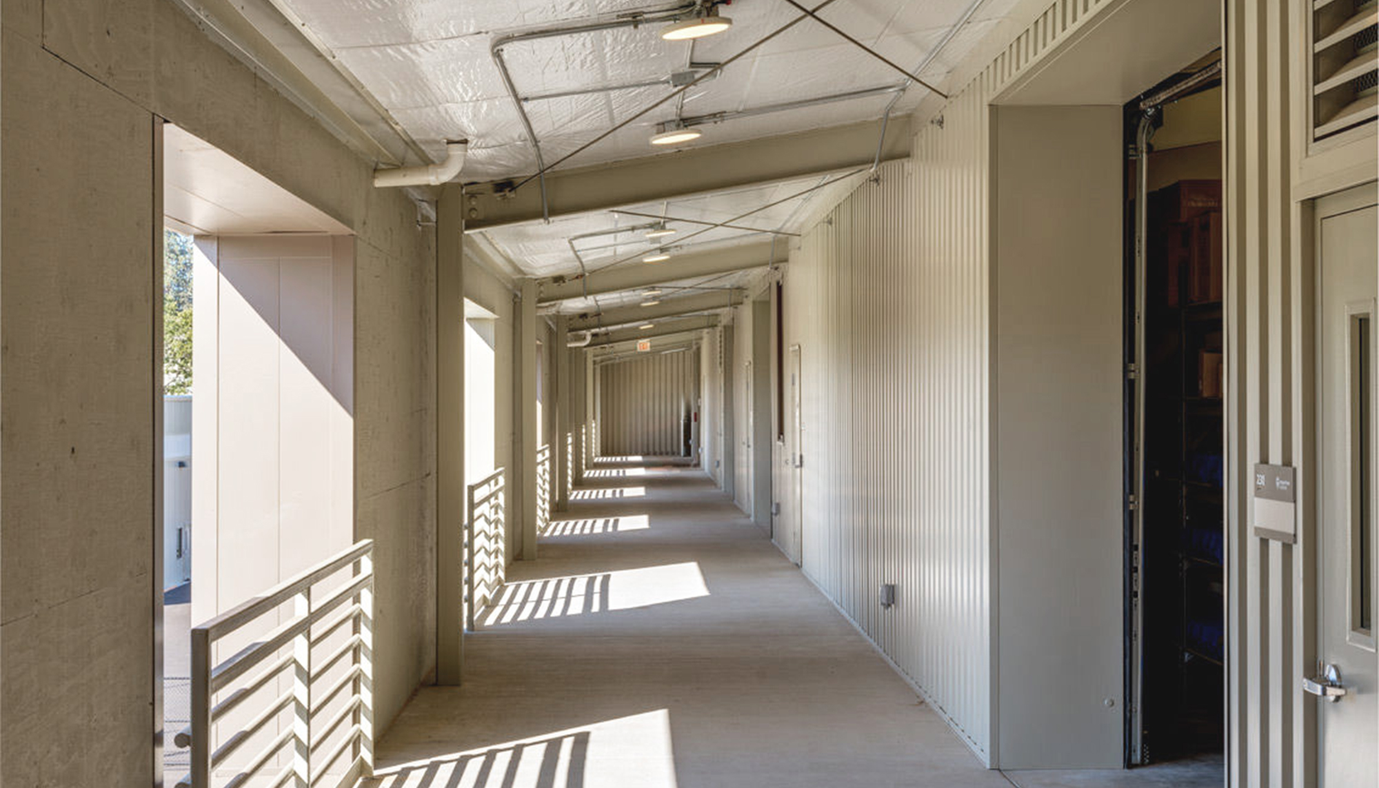 Interior corridor at the Oregon State University Campus Operations Center featuring integrated circulation space and coordinated building systems designed to support efficient campus operations and long-term facility functionality.