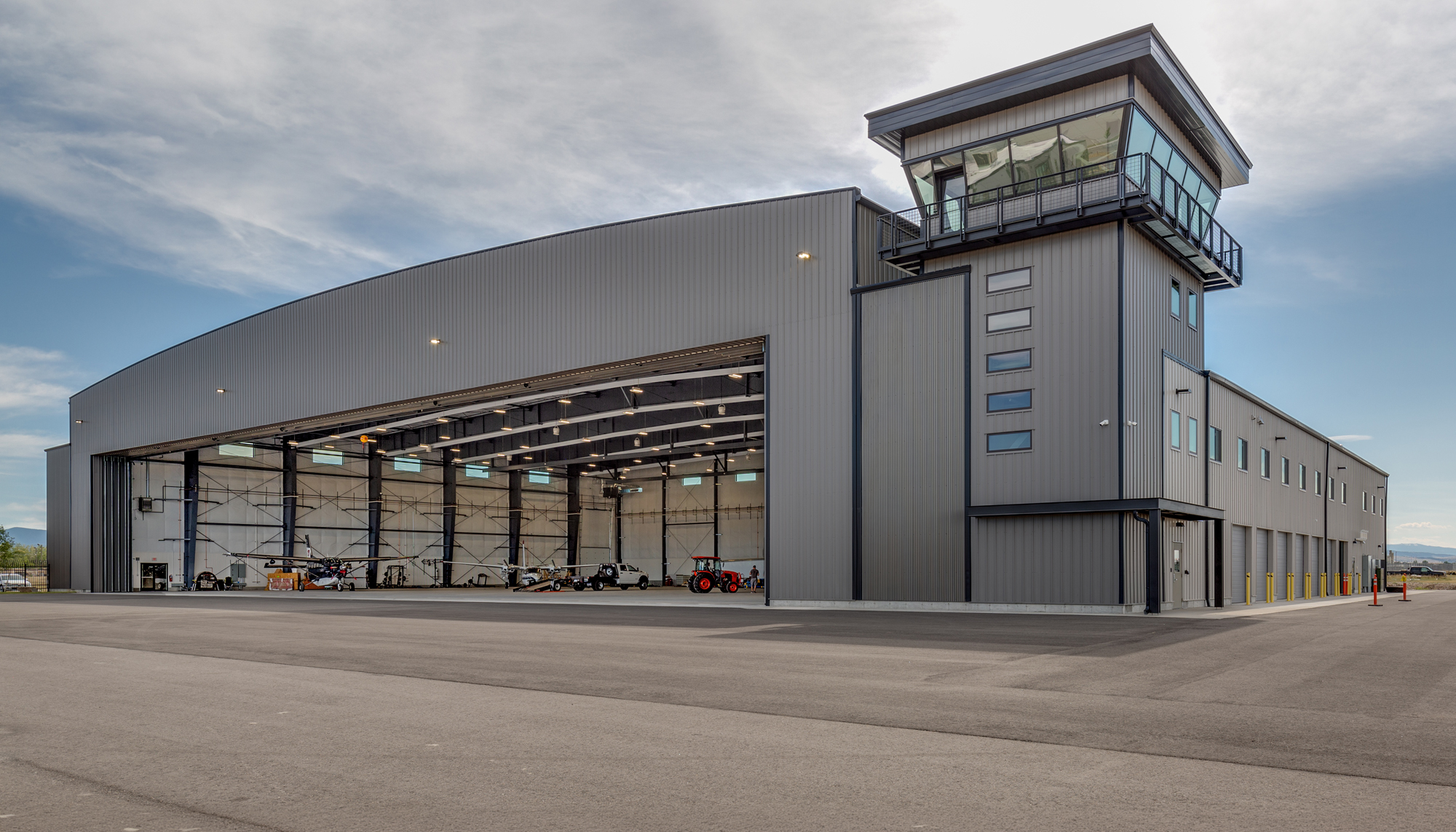 Bridger Aerospace Hangar featuring clear span steel framing, aircraft maintenance bays and integrated air operations tower.