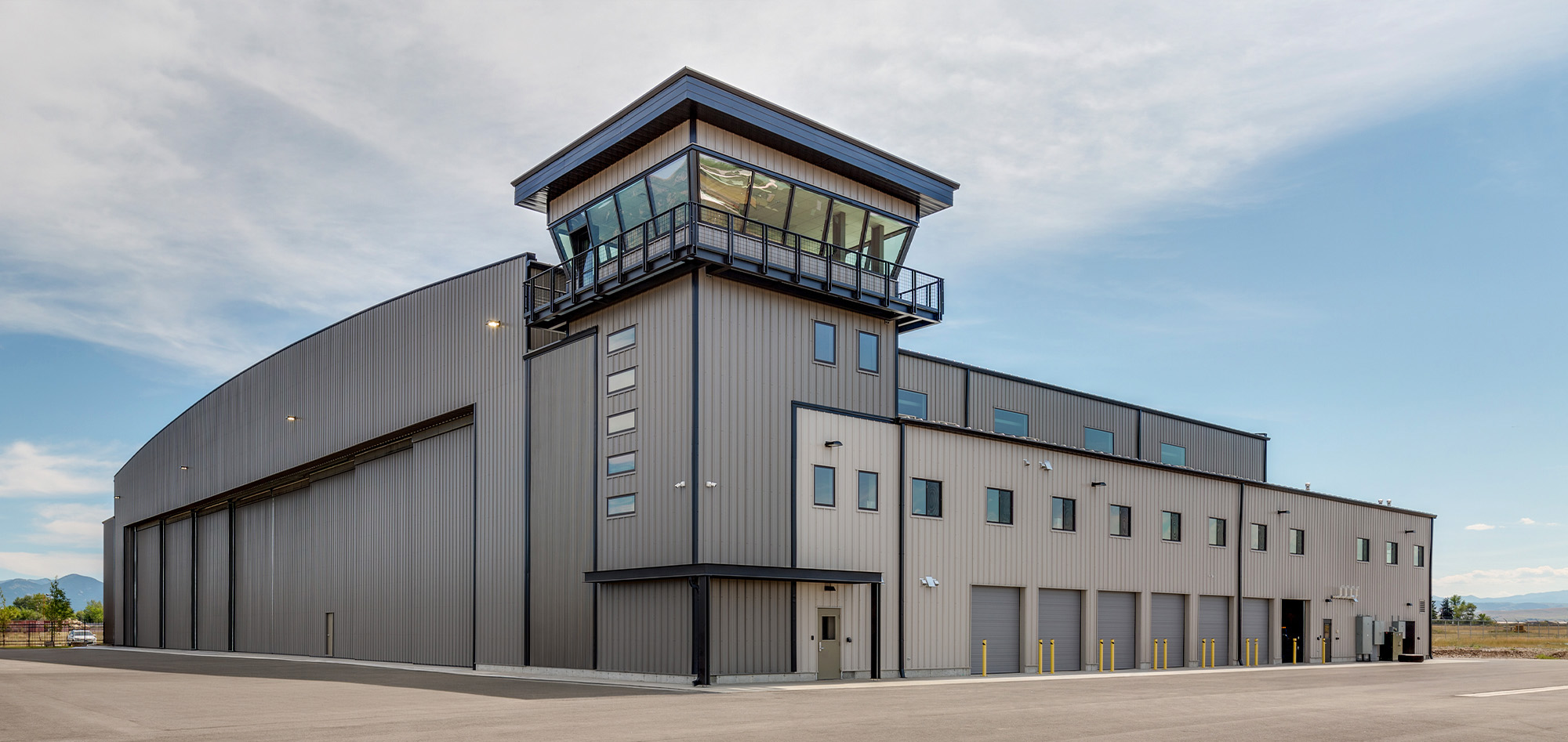 Bridger Aerospace Hangar featuring clear span steel framing, aircraft maintenance facility and pre-engineered metal building construction.
