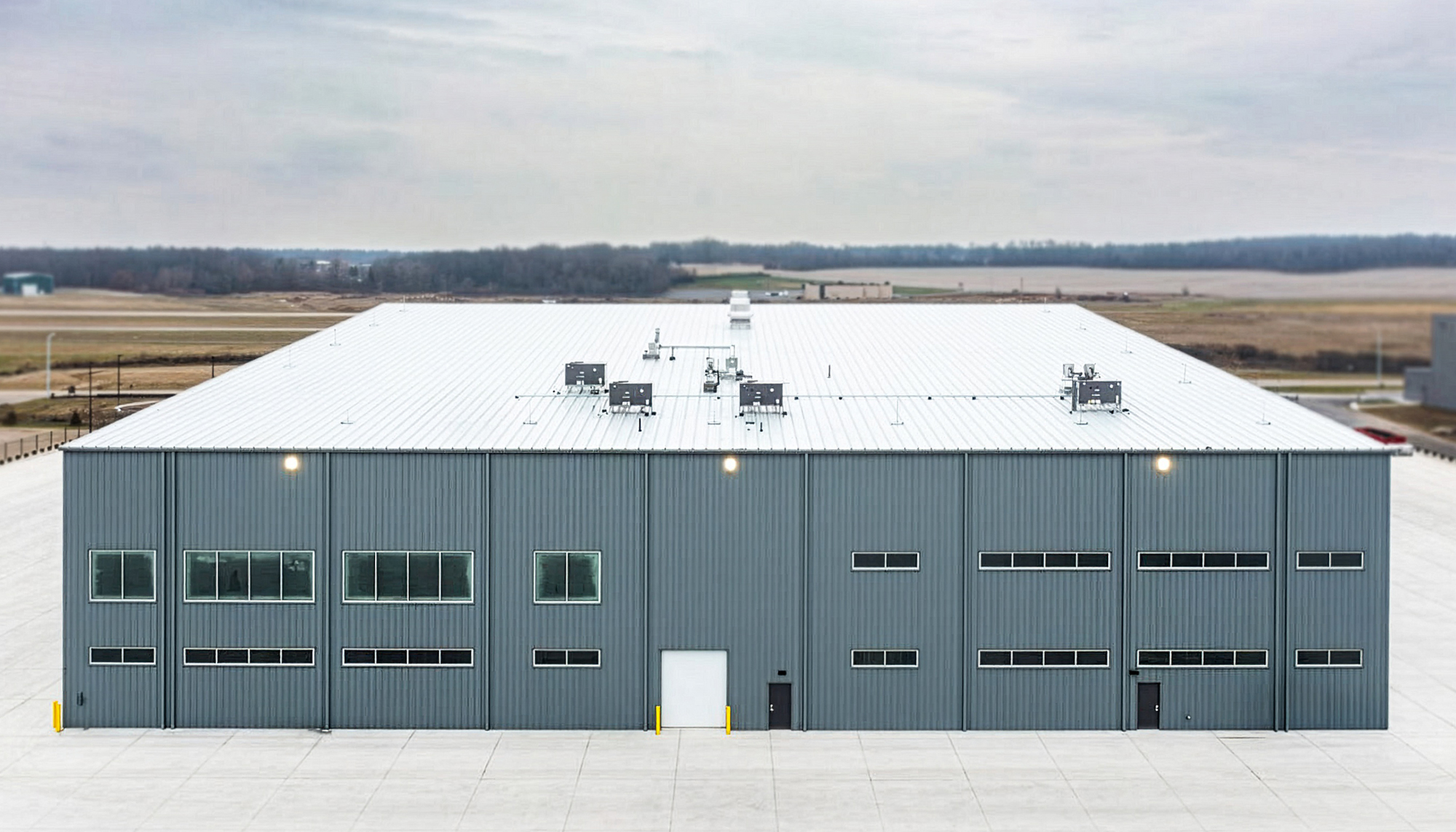 Exterior view of the Duncan Aviation aircraft maintenance hangar featuring large service bay access and integrated support systems.