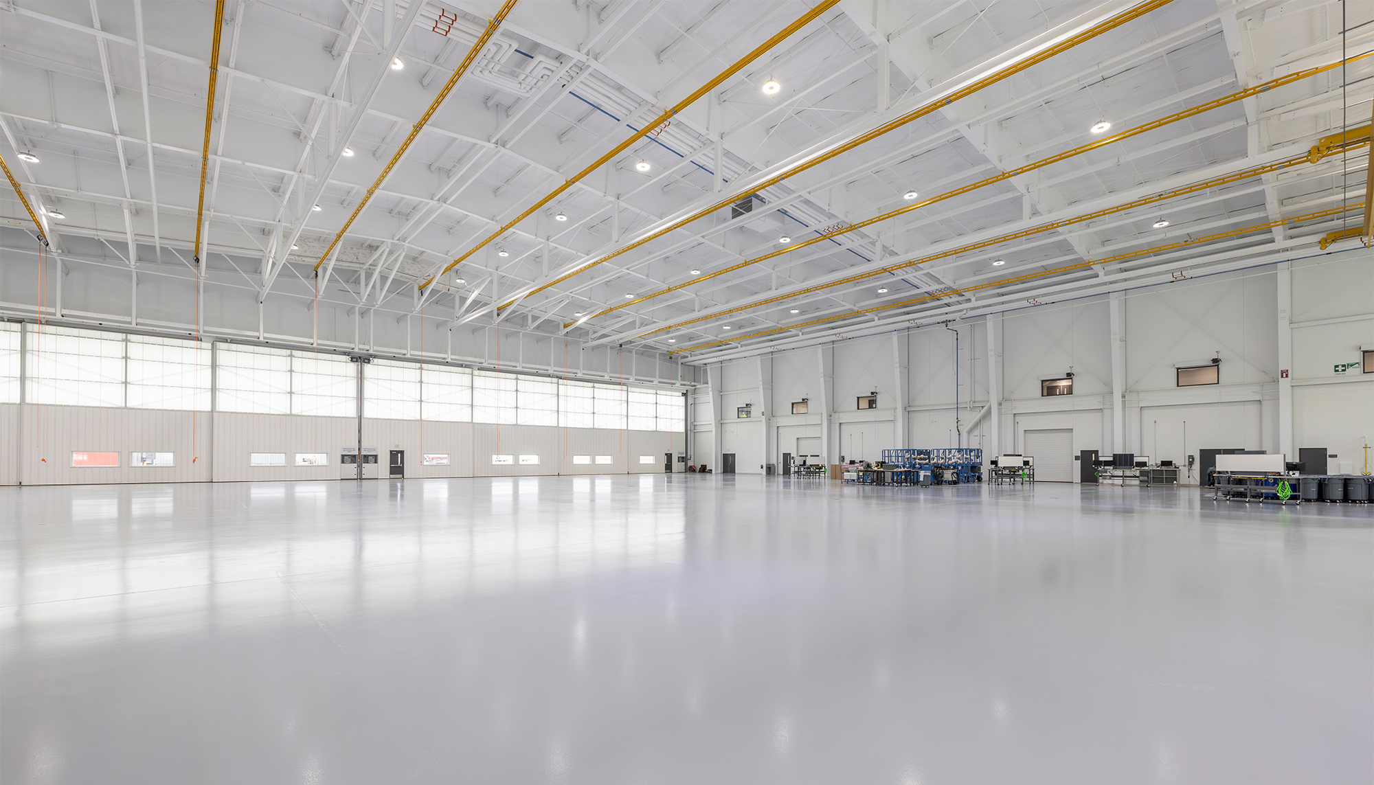 Aircraft maintenance hangar interior at Duncan Aviation featuring clear-span workspace and integrated lighting systems.