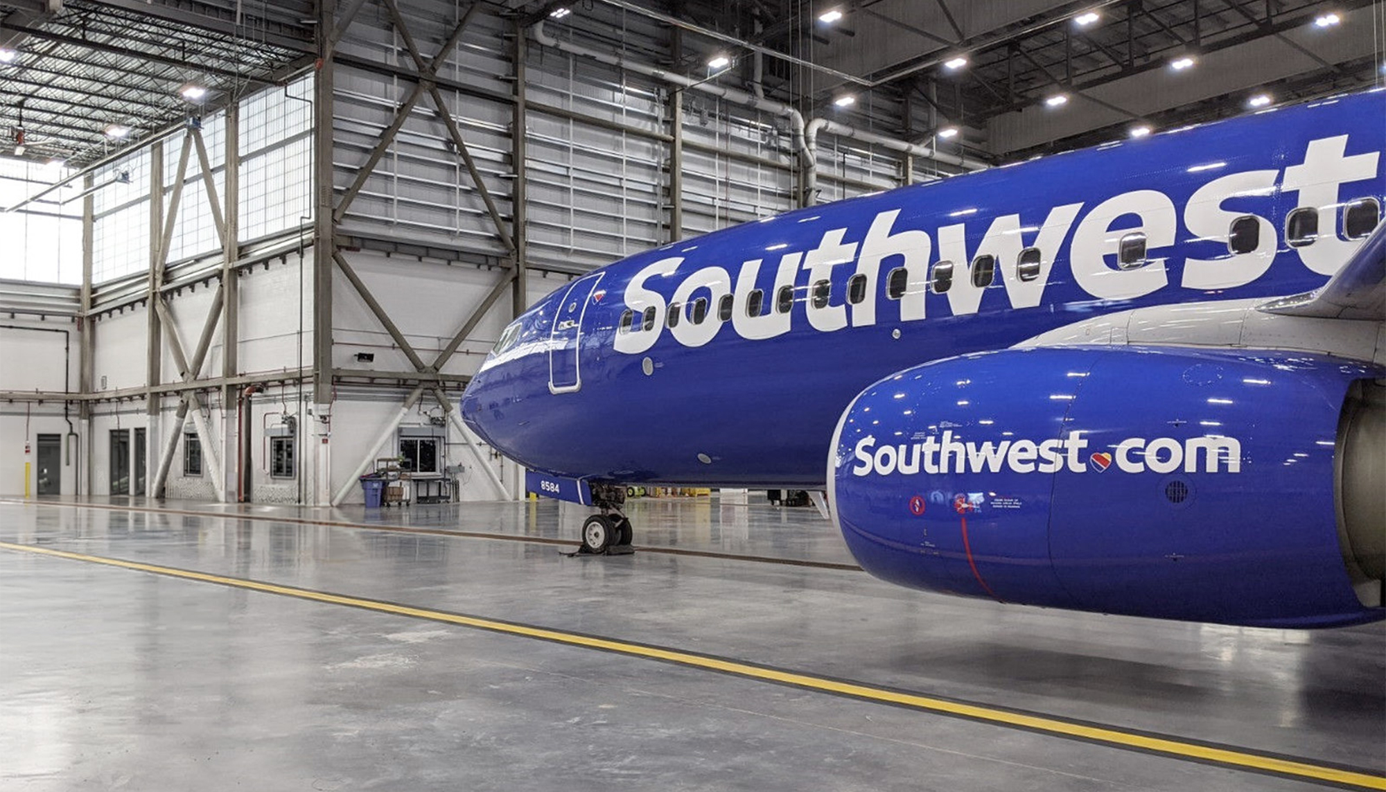 Interior aircraft maintenance space inside the Southwest Airlines Maintenance Hangar featuring expansive clear-span construction, integrated overhead systems and an open operational layout designed to support efficient servicing of large aircraft.