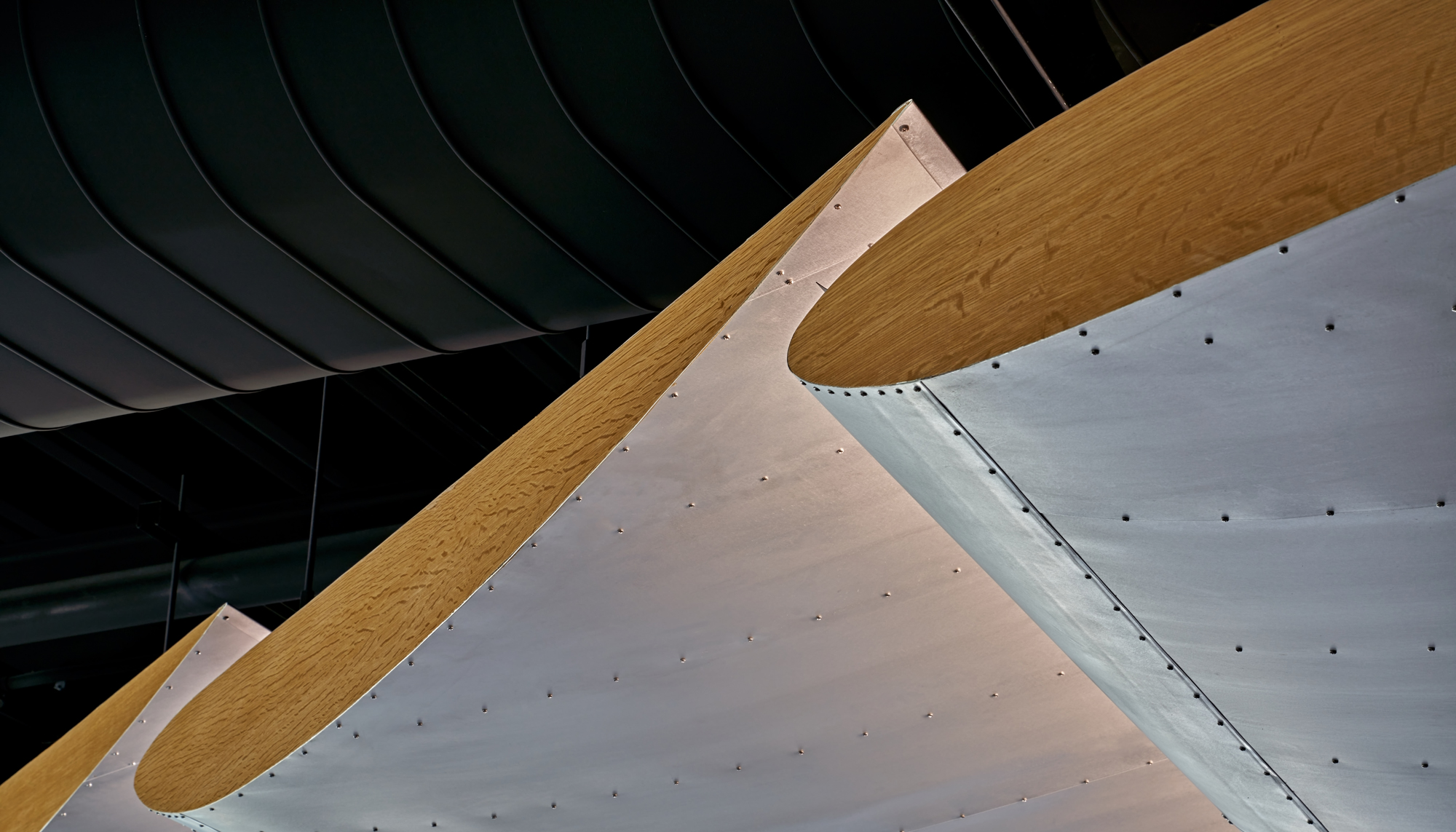Architectural interior detail at the WACO Aircraft Corp. facility featuring integrated ceiling elements and coordinated design finishes developed to support a cohesive aviation customer experience environment.