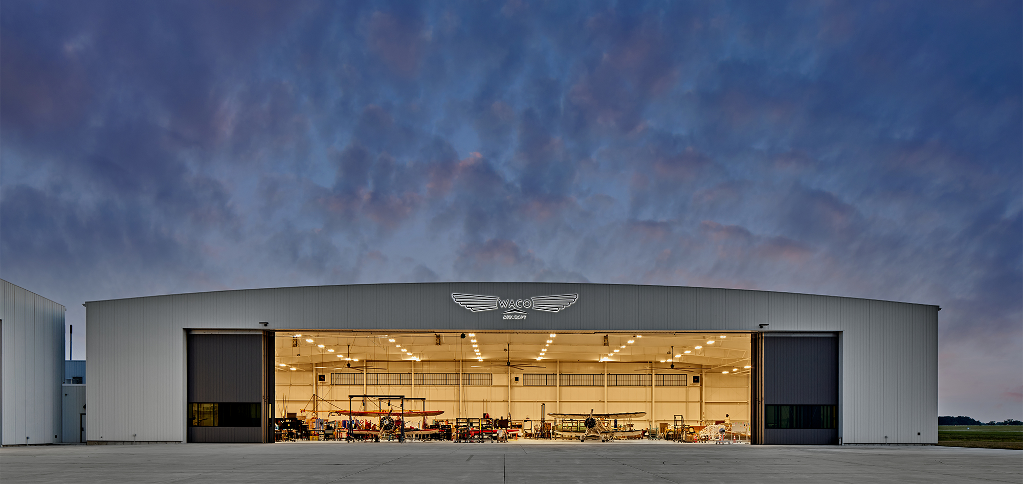 Massive aircraft hangar at night 