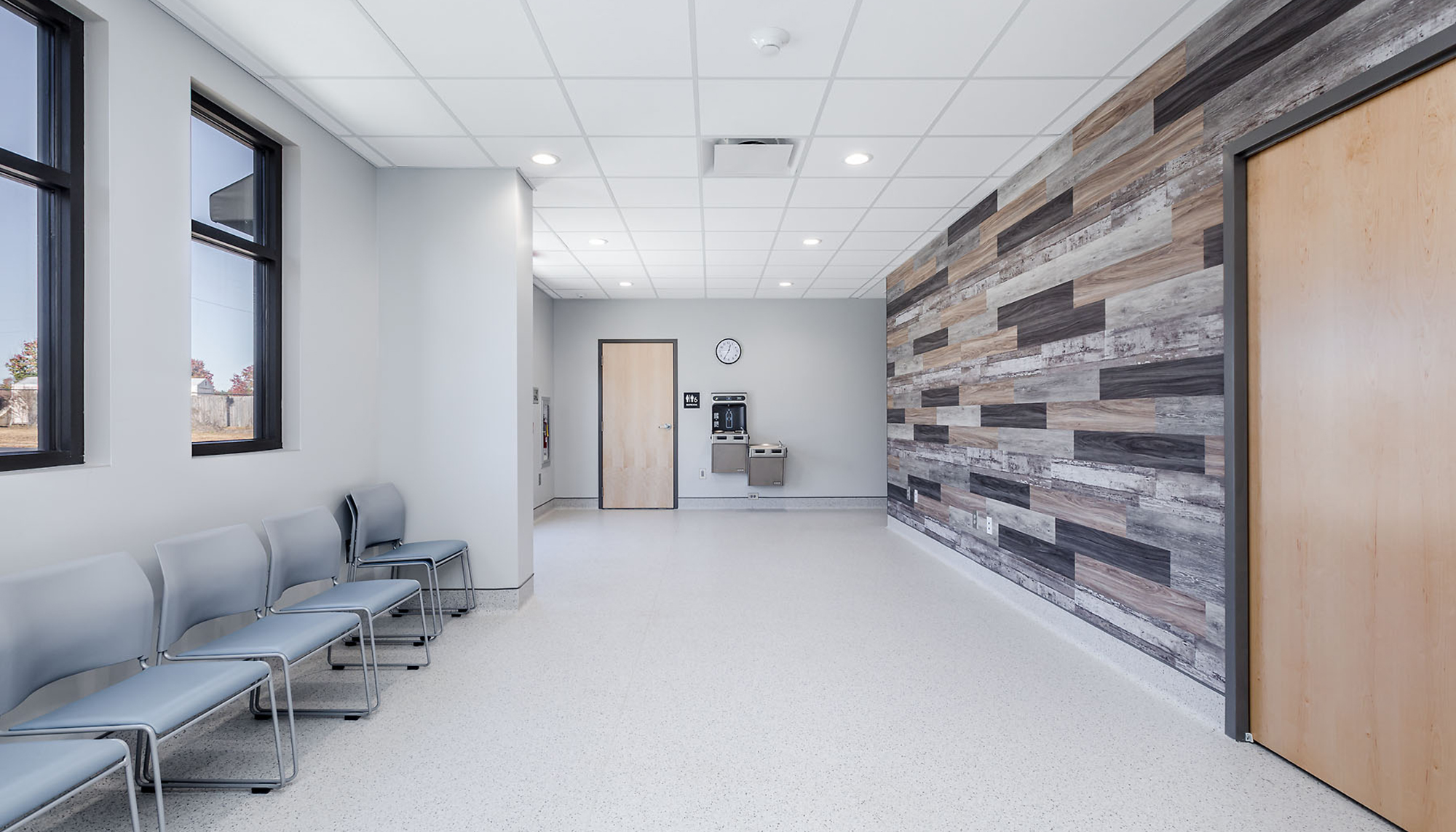 Interior waiting area at the Almost Home Wellness Center featuring integrated patient seating, coordinated circulation space and a veterinary environment designed to support efficient operations and a welcoming care experience.