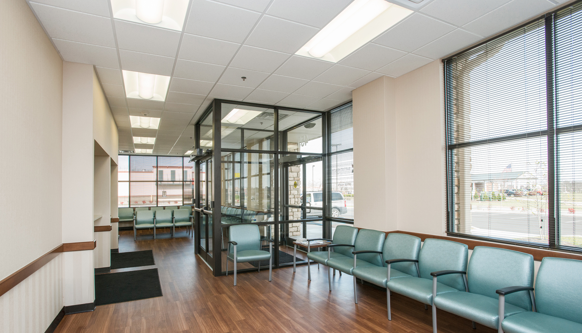 Interior waiting area at the Baptist Health outpatient facility featuring integrated patient seating, natural light and coordinated circulation spaces designed to support comfort, accessibility and efficient care delivery.