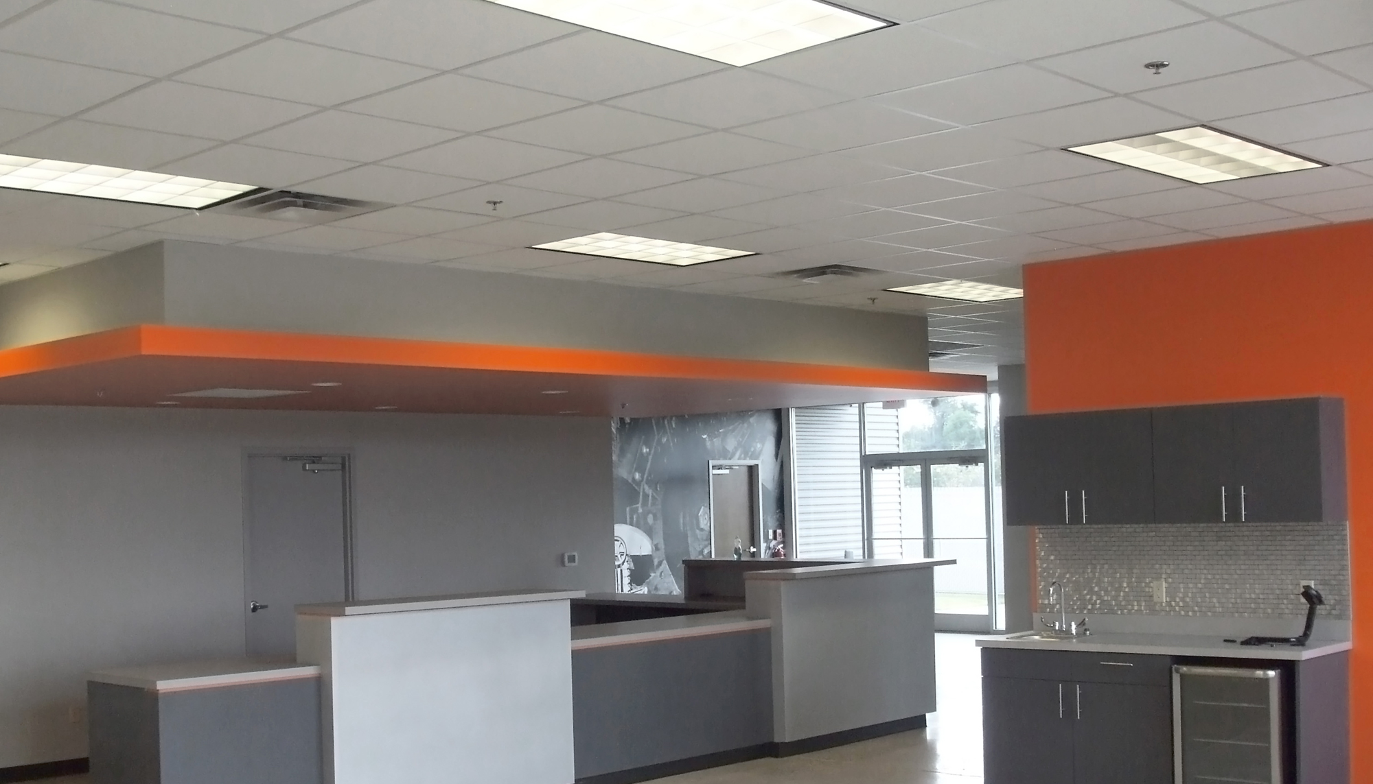 Interior office and reception area at the Ditch Witch Mid South facility featuring modern finishes and customer service workspace.