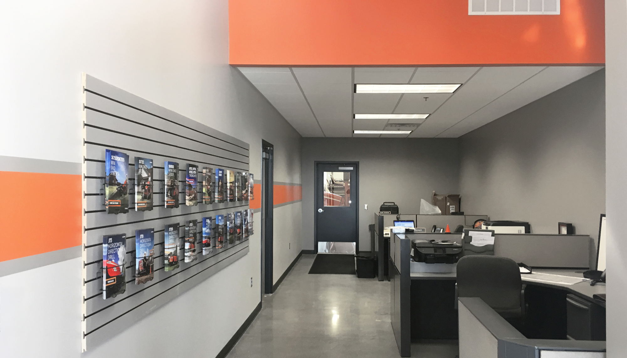 Interior office and retail workspace at the Ditch Witch of Minnesota & Iowa facility featuring integrated customer service areas.