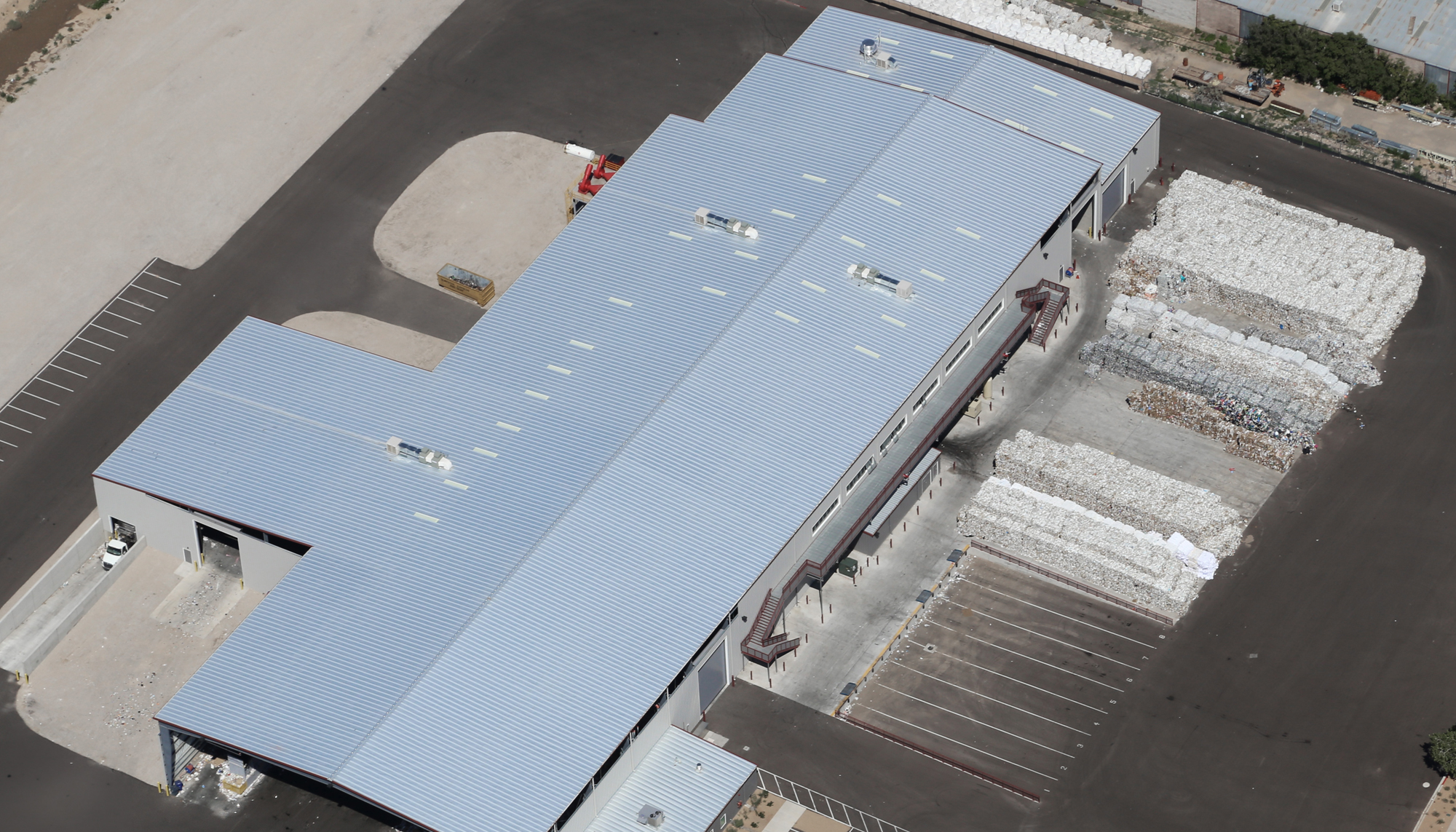 Aerial top view of the Friedman Recycle Center featuring large-scale processing and material storage areas, integrated operational infrastructure and a durable industrial layout designed to support efficient recycling operations and heavy equipment demands.
