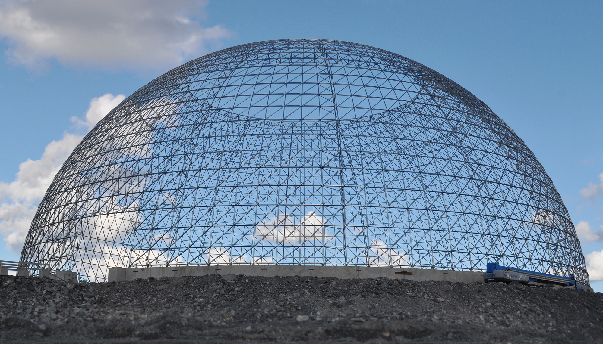 Large-span dome structure at the GreenStone Gold Mines site featuring exposed steel framework and integrated industrial enclosure design.