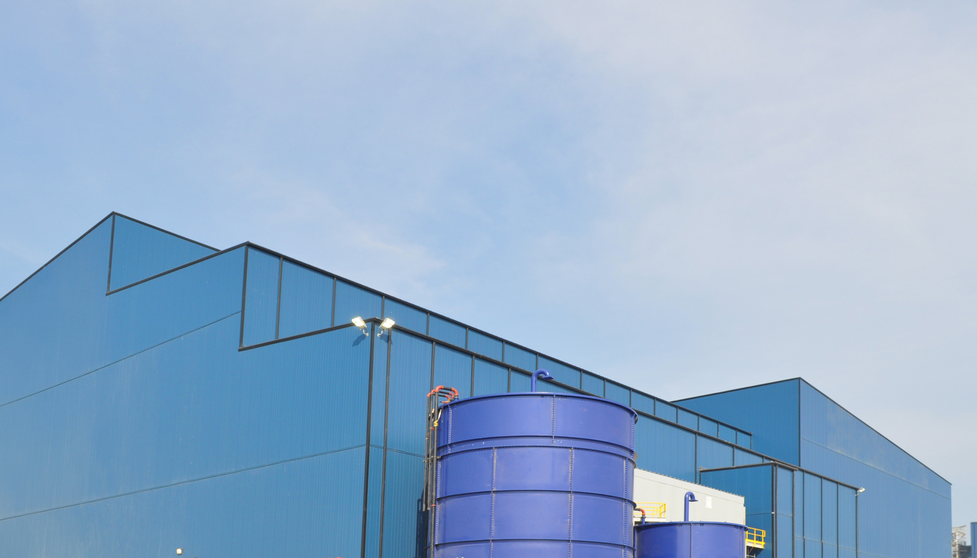 Industrial processing facility exterior at the GreenStone Gold Mines site featuring insulated wall systems and integrated processing infrastructure.