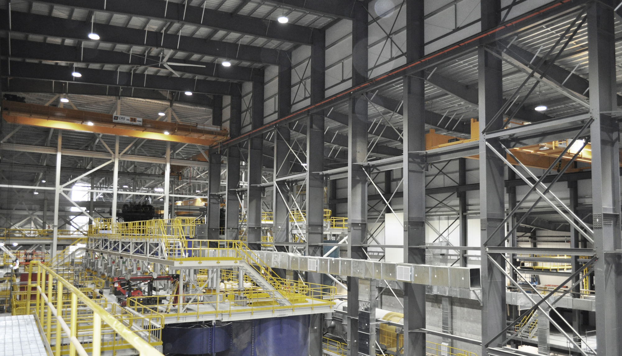 Industrial processing facility interior at the GreenStone Gold Mines site featuring multi-level steel framing, crane systems and integrated operational infrastructure.