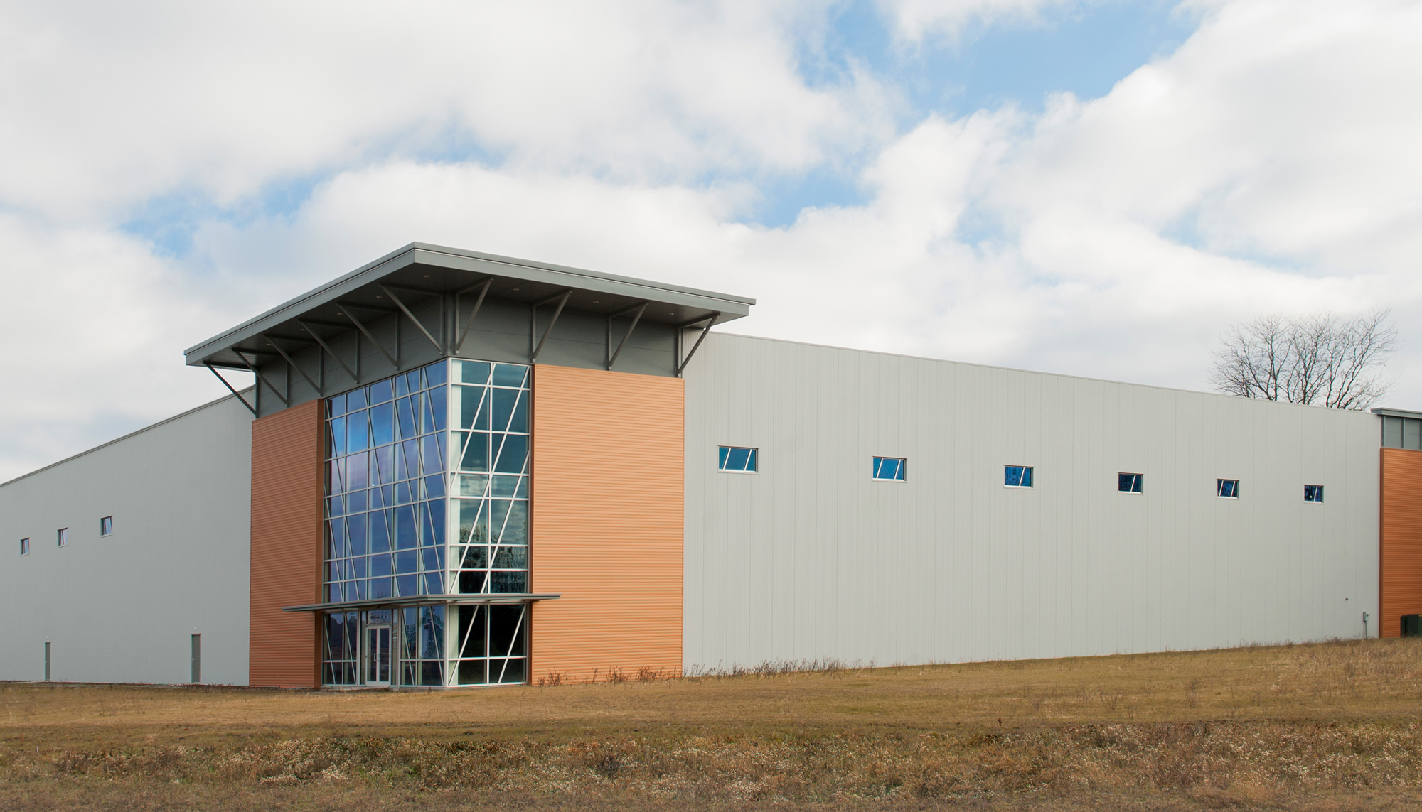 Exterior perspective view of the Interstate Park Spec Building featuring an energy-efficient building envelope, integrated glazing and coordinated structural systems designed to support operational durability and a consistent professional appearance.