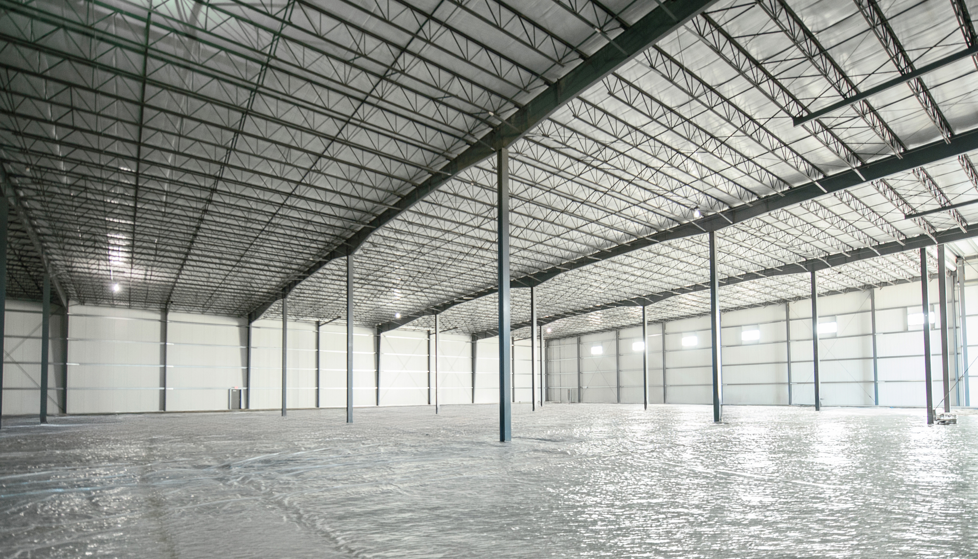 Interior storage space within the Interstate Park Spec Building featuring open-span construction, integrated insulation systems and coordinated structural design developed to support operational efficiency, durability and long-term facility performance.