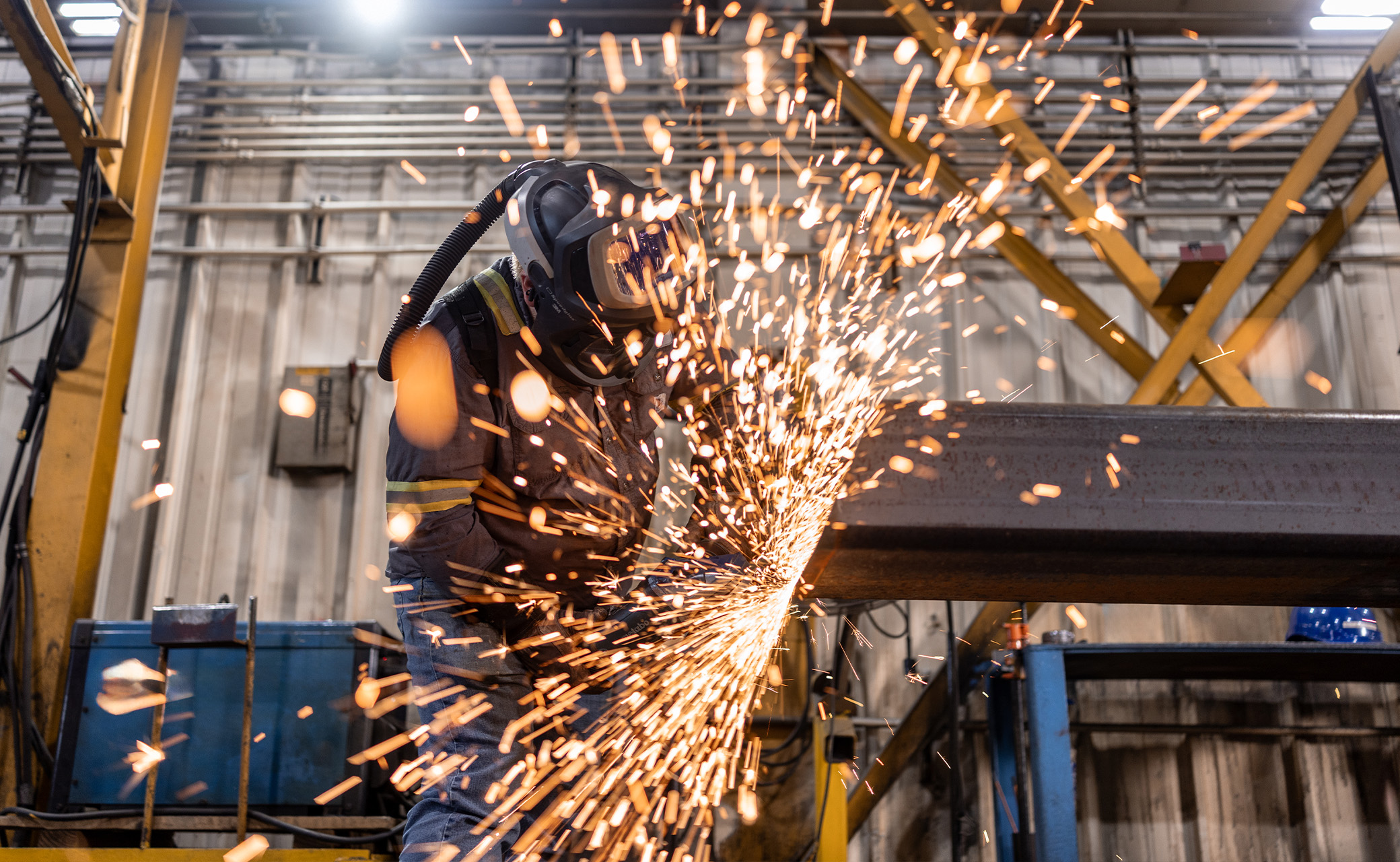 Welder at work with sparks flying