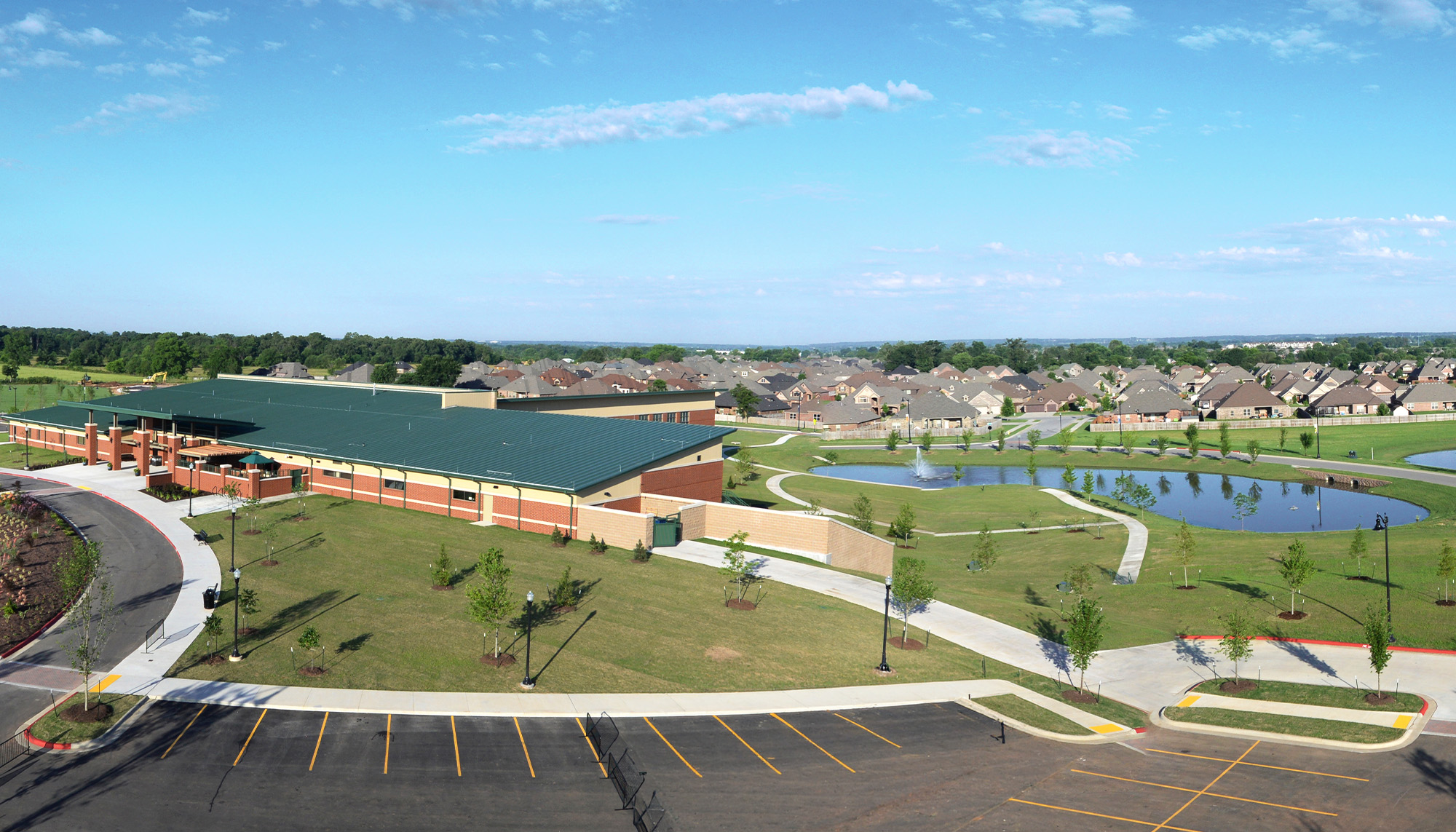 Community recreation center featuring metal building construction, standing seam roof system and integrated athletic facilities.