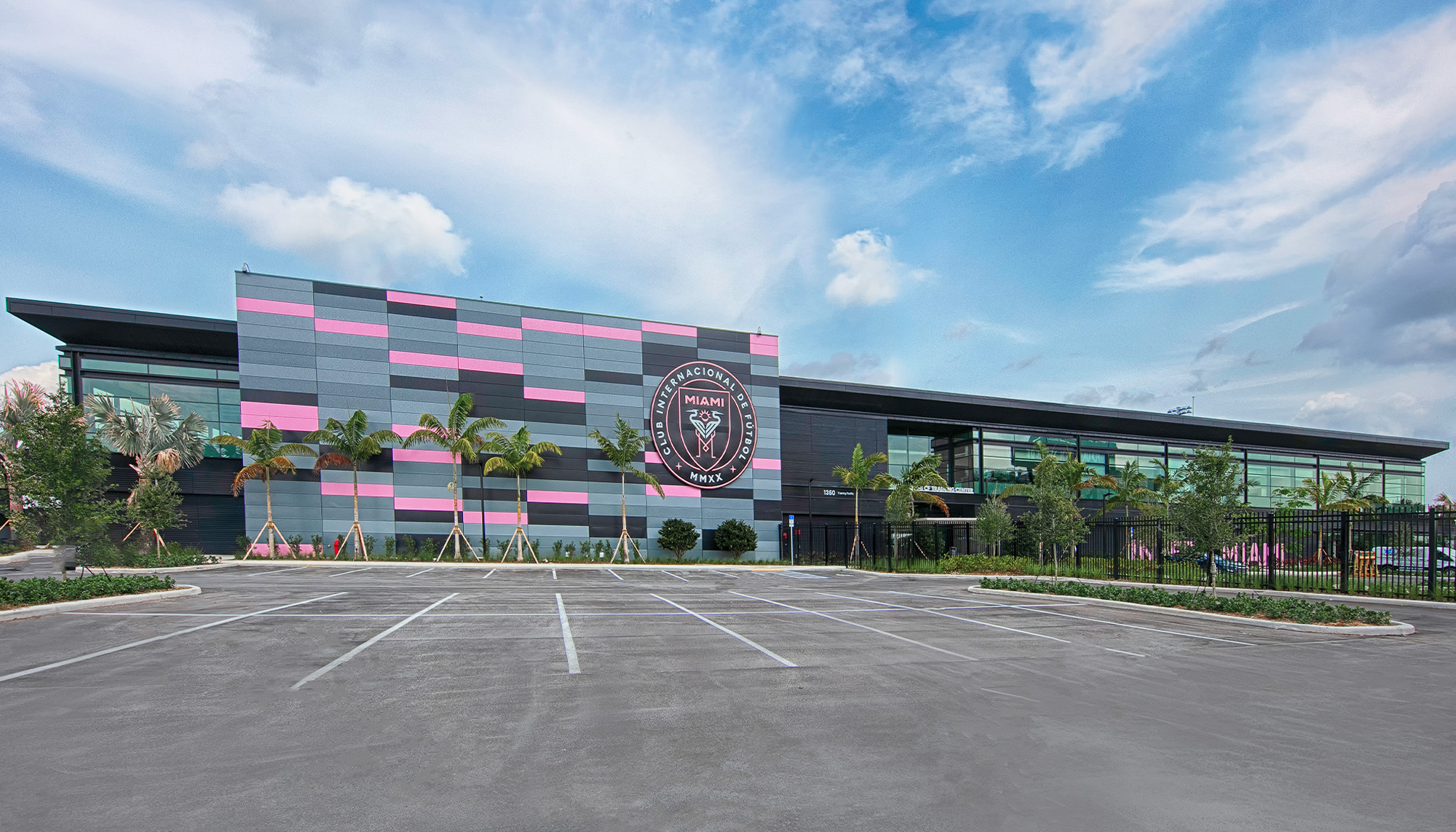 Inter Miami CF training center with steel building construction, expansive glass facade and elite athletic performance facility design.