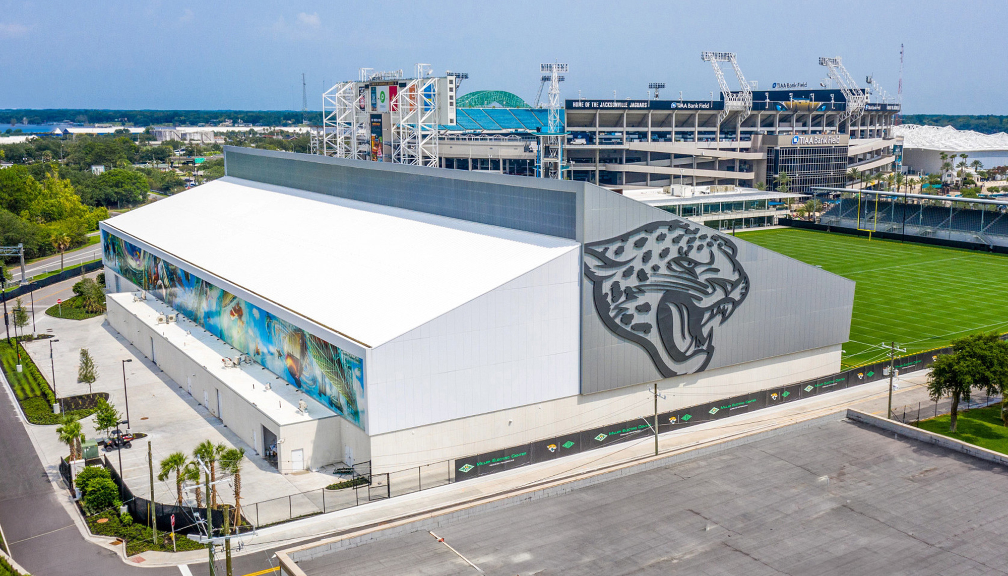 Aerial exterior view of the Jacksonville Jaguars Indoor Practice Facility featuring integrated indoor training space, adjacent practice fields and coordinated athlete performance environments designed to support team operations, recovery and long-term development.
