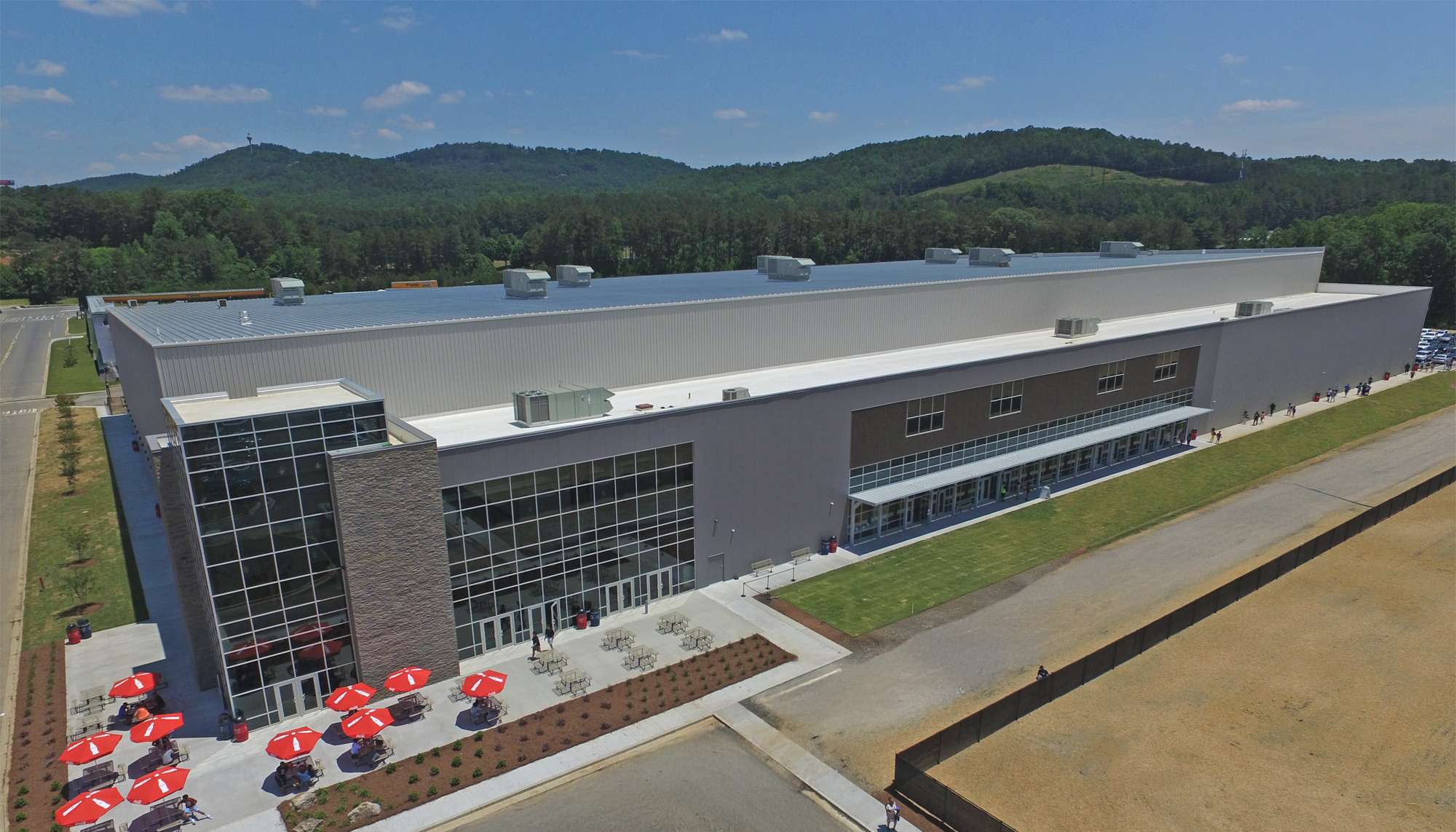 Aerial view of the LakePoint Sports Champions Center featuring a large clear-span indoor athletic facility with expansive glazing, integrated entry plaza and long-span construction designed for flexible multi-sport use.
