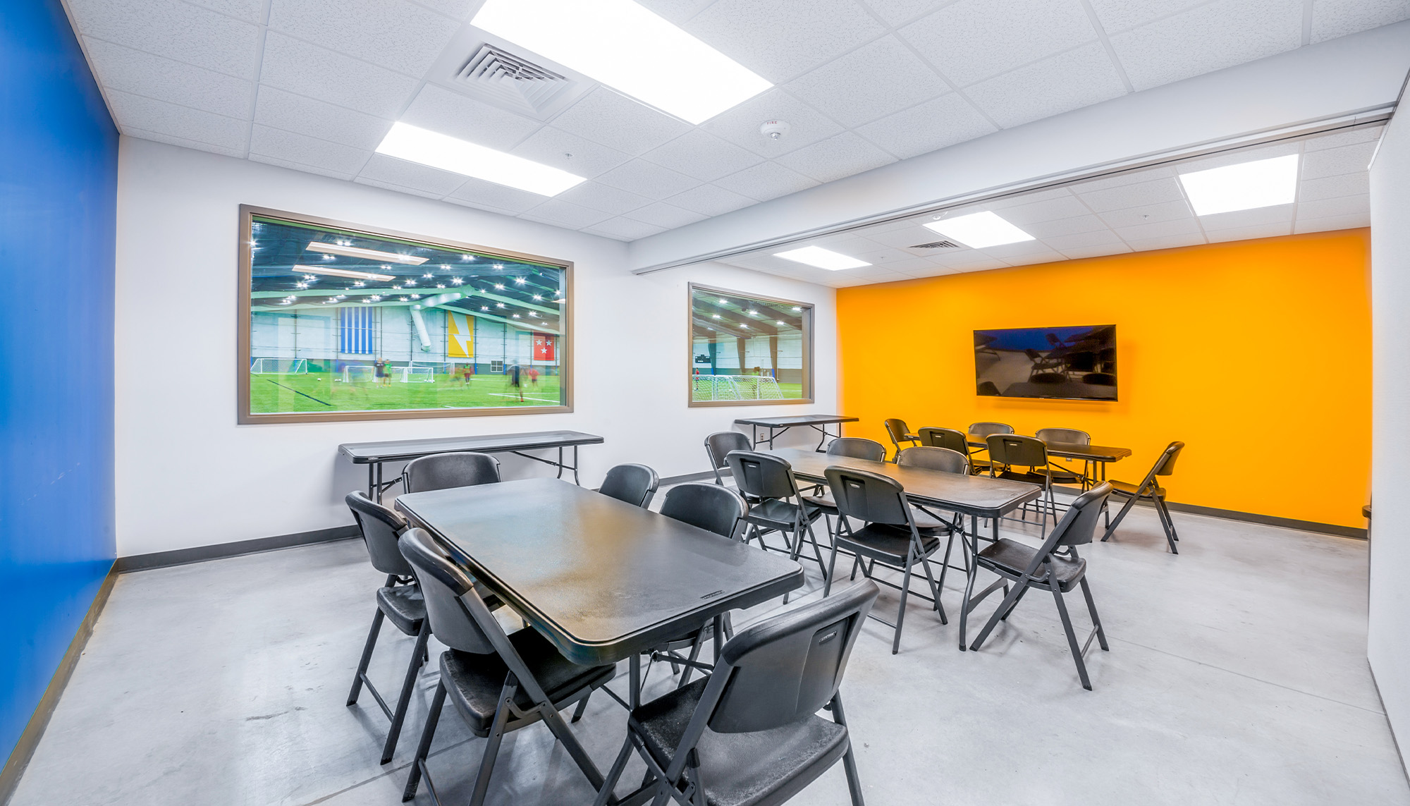 Stryker Sports Complex conference room with team meeting area, field viewing windows and recreation facility amenities.