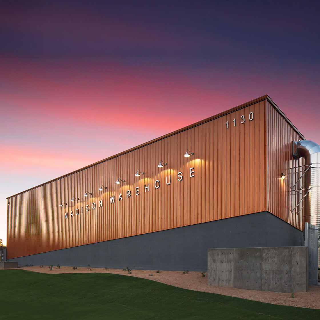 Image of a VP warehouse with sunset in the background