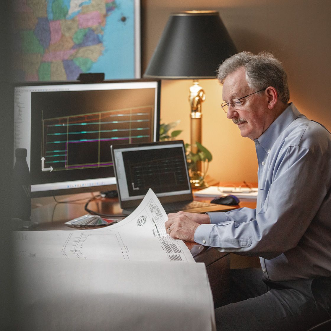 Construction manager working with documents and proprietary technology