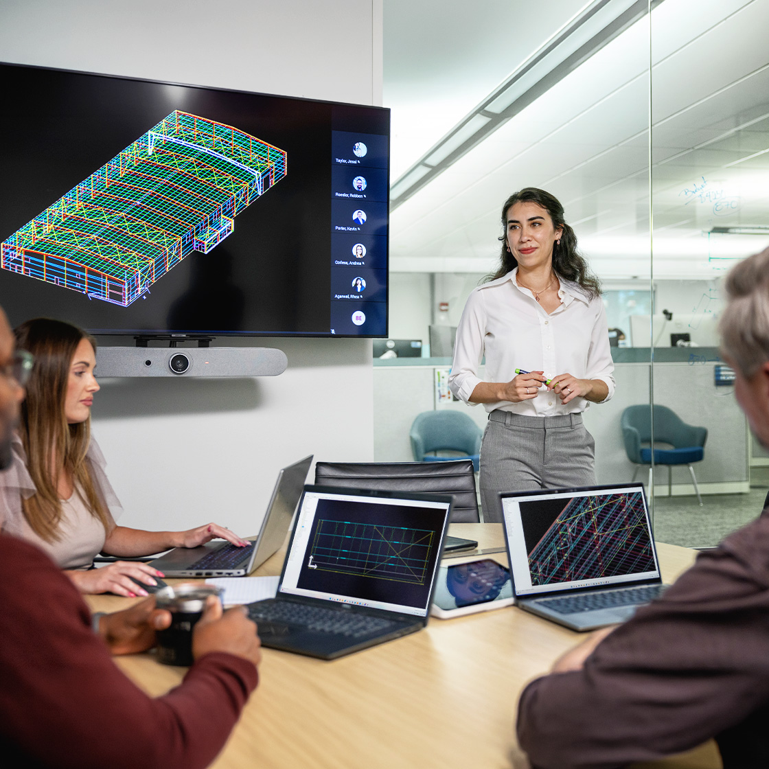 Team members collaborating around a VP Tech Connect workstation displaying digital construction coordination and VP Command project tools.